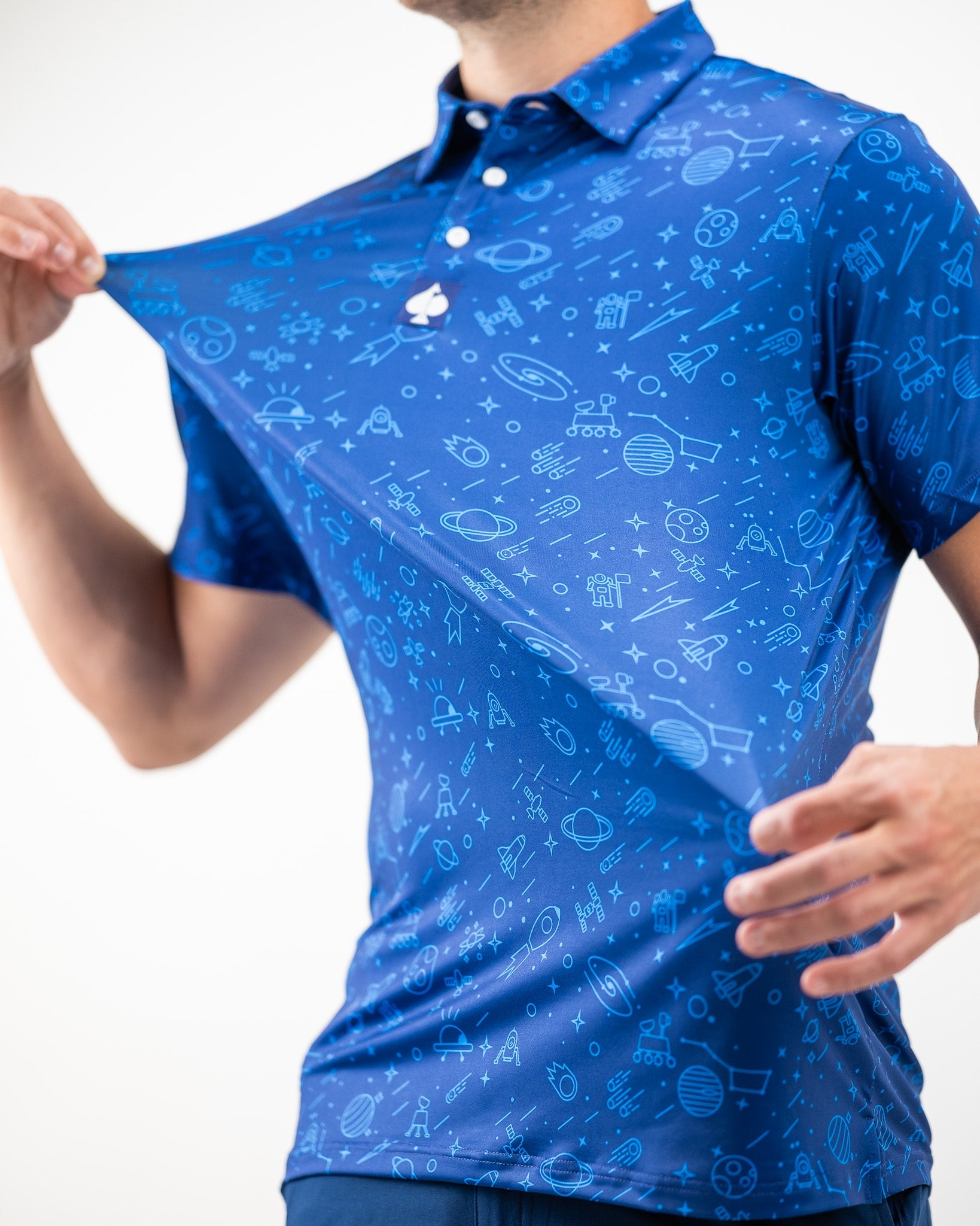 Bold blue NASA polo featuring a playful space-themed pattern, perfect for golfers who want to stand out on the course.