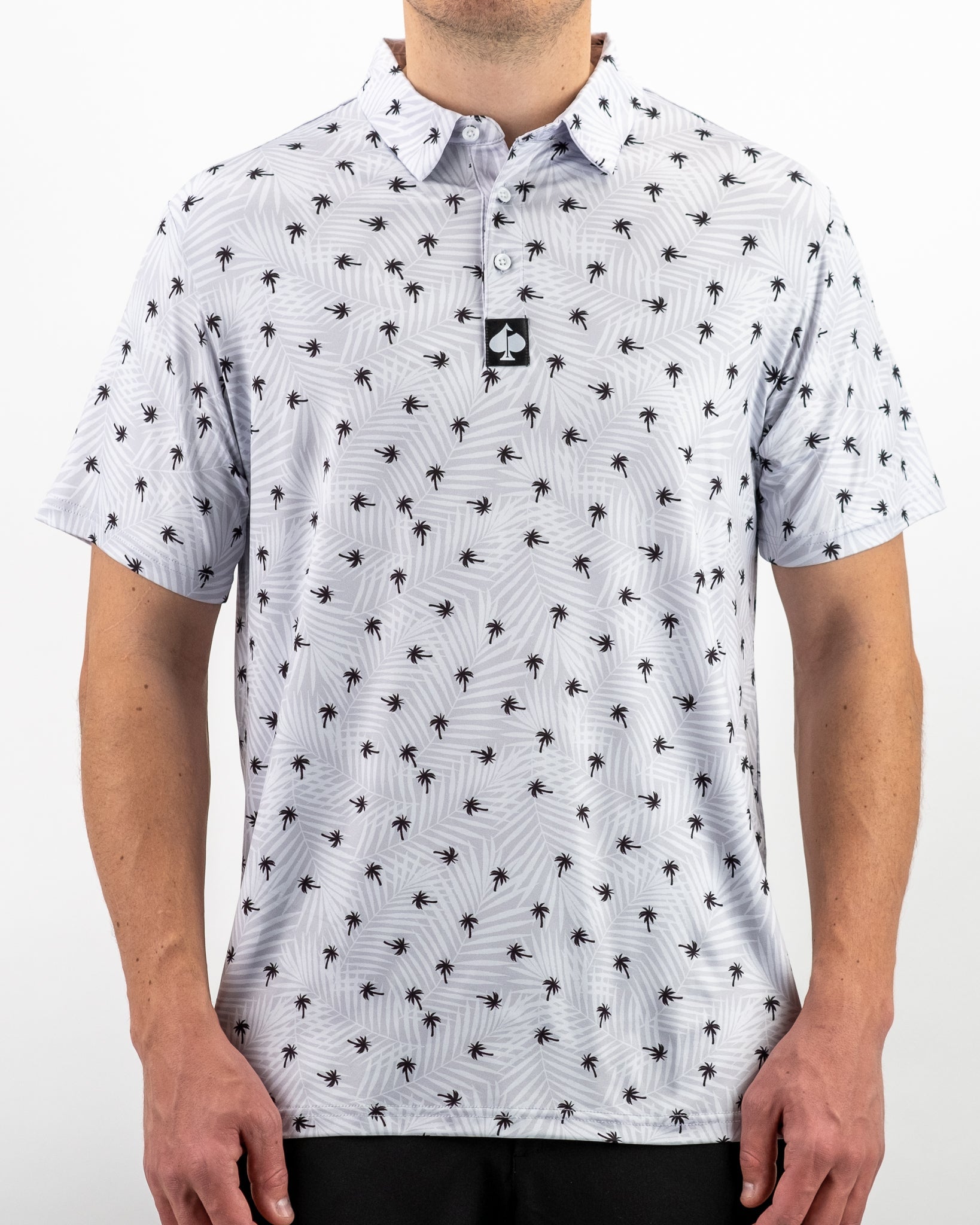 Men's golf polo featuring a stylish palm tree pattern on a light background, perfect for a bold look on the course.