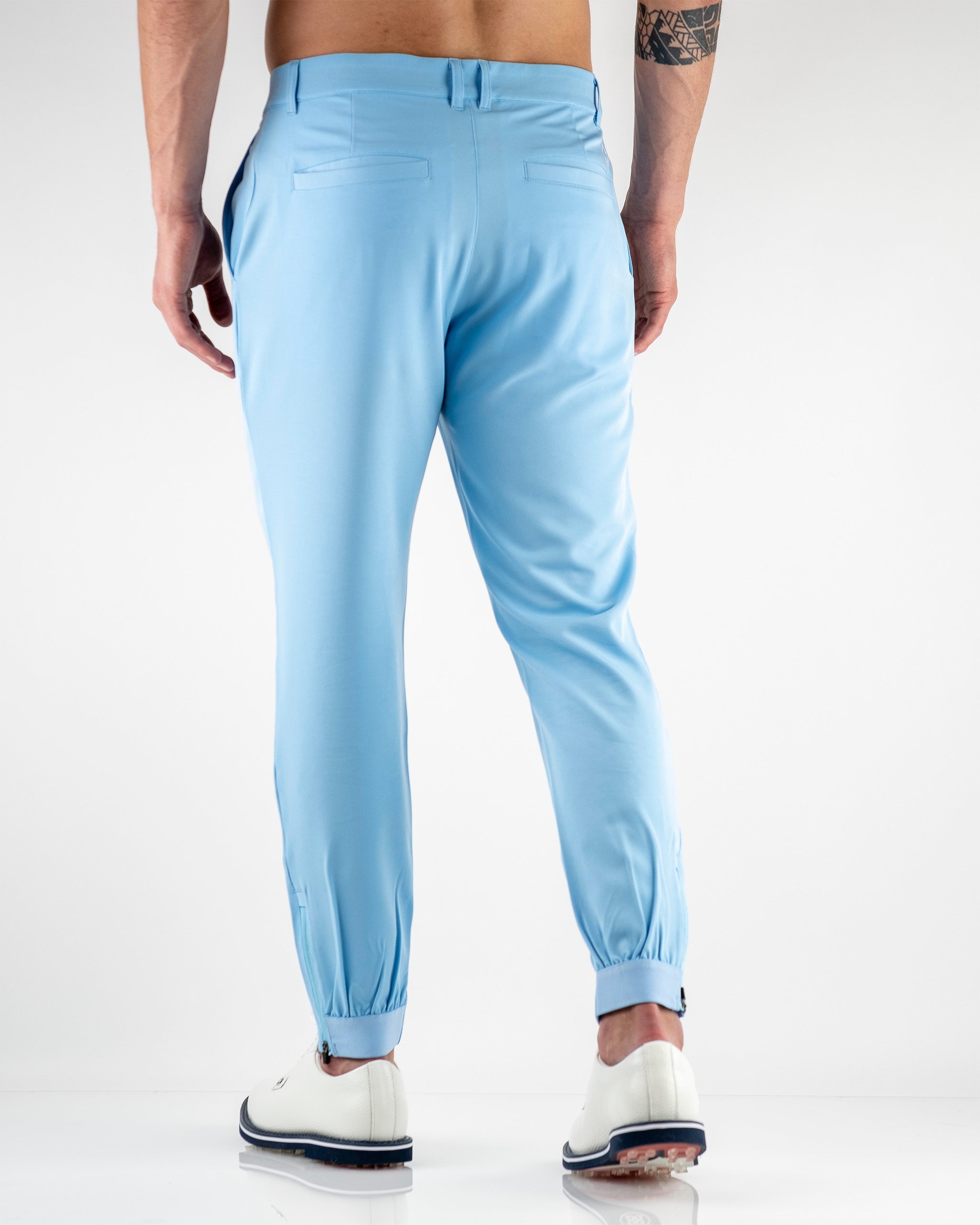 Sky blue performance jogger for men, featuring a tapered fit and elastic cuffs, ideal for stylish comfort on the golf course.