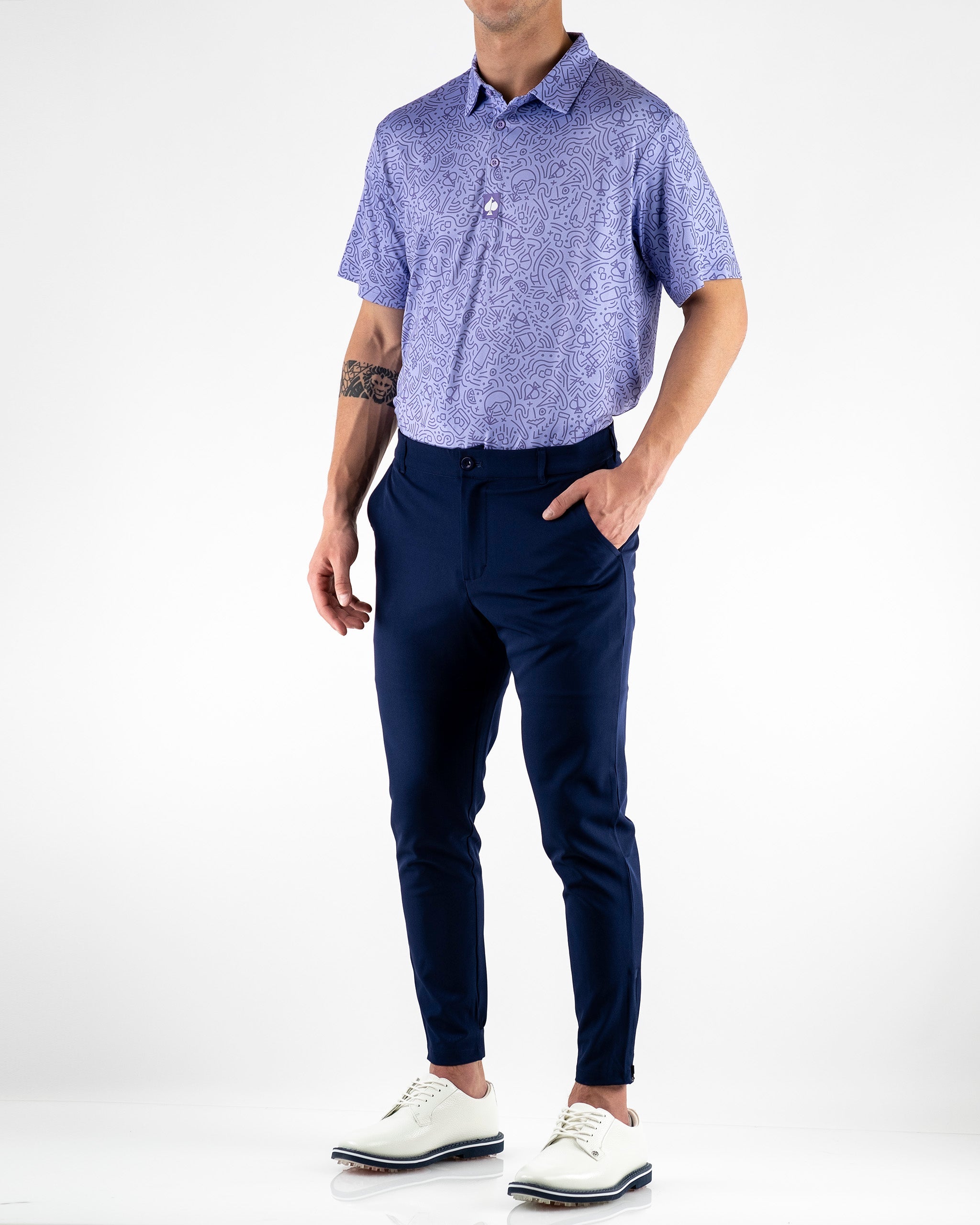 Navy performance jogger paired with a patterned purple polo, ideal for stylish golf outings and casual wear.