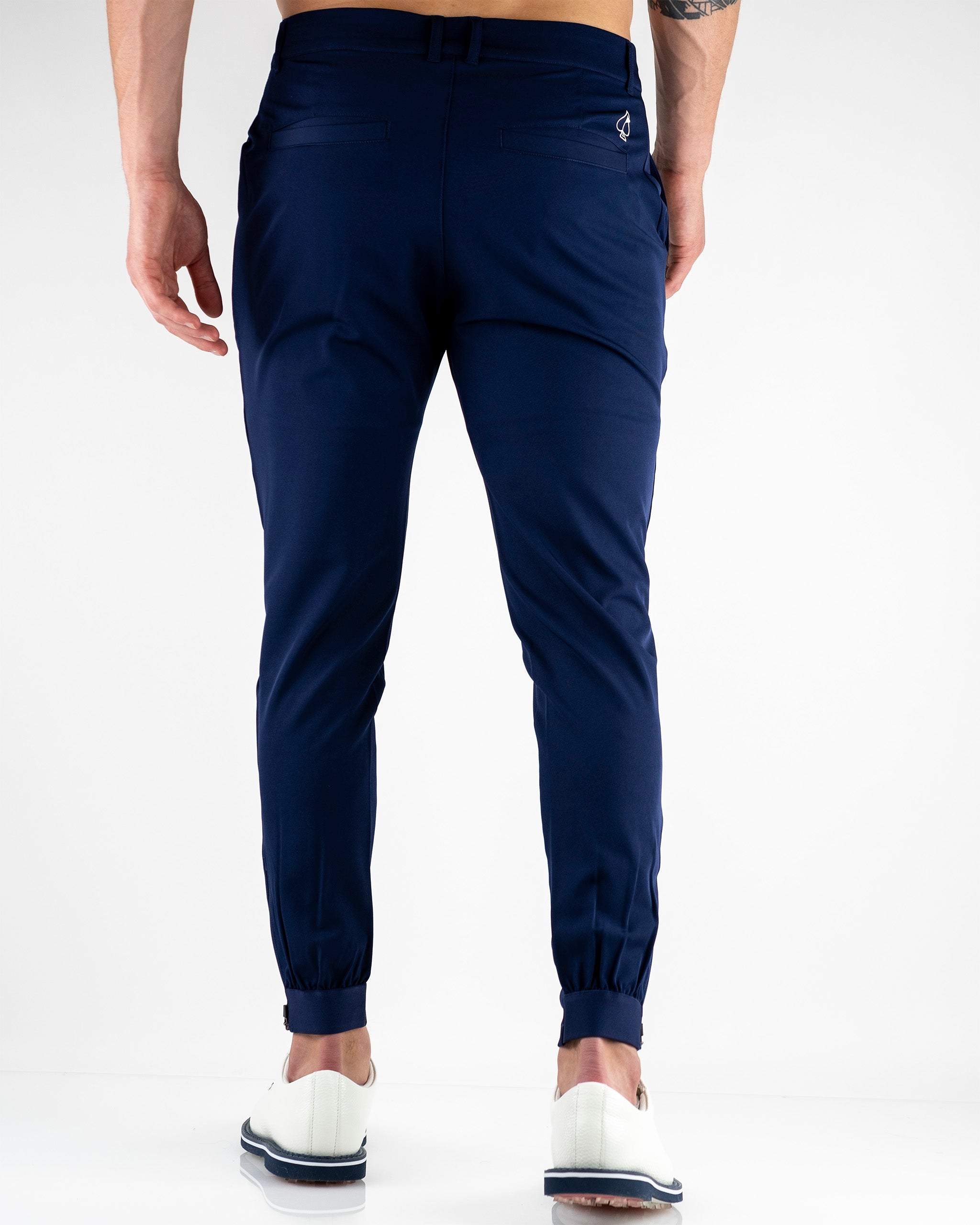 Navy performance jogger featuring a tapered fit and elastic cuffs, ideal for comfort and style on the golf course.