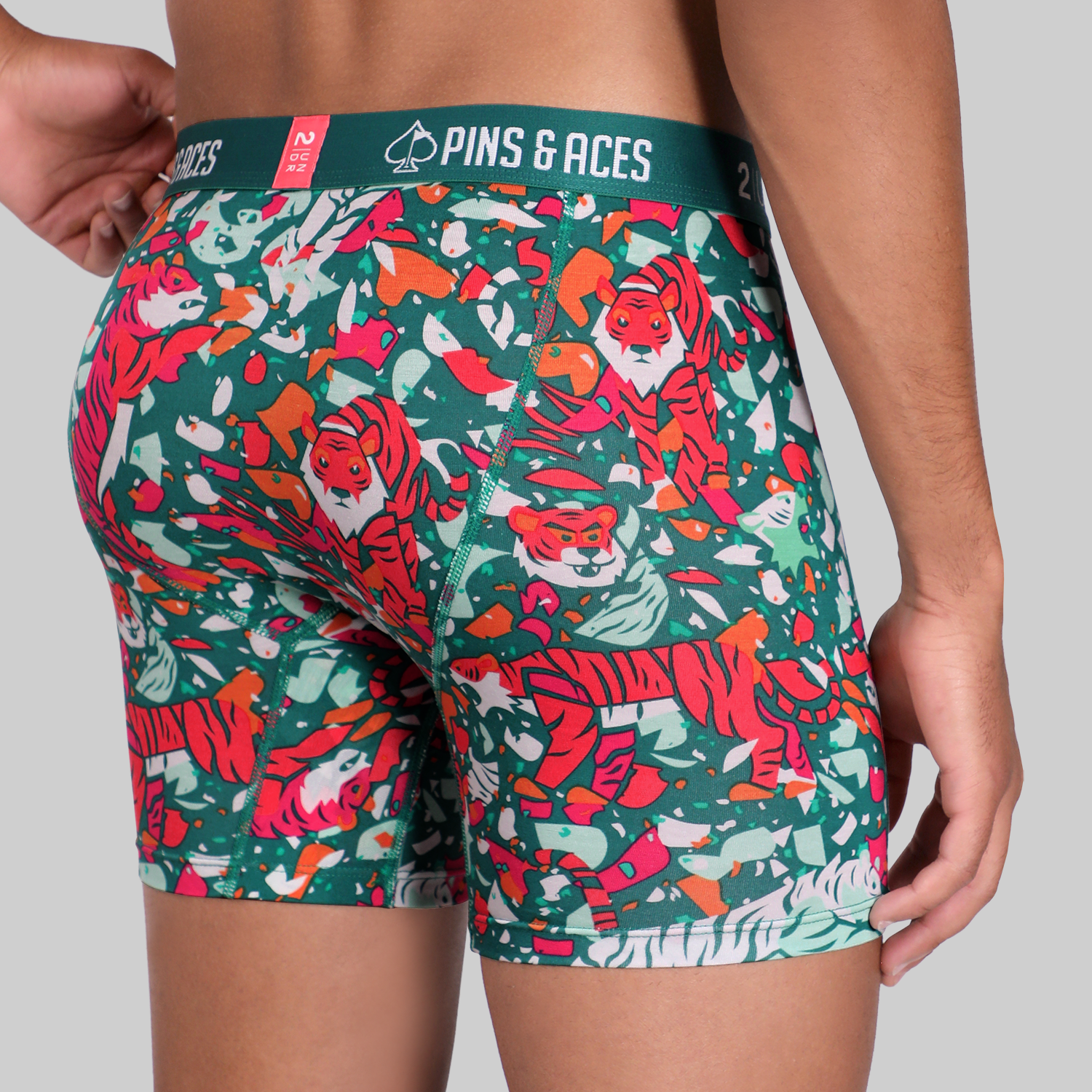 Bold 2UNDR x P&A Swing Shift 6" Box Briefs featuring a vibrant tiger print design, perfect for stylish comfort on the golf course.