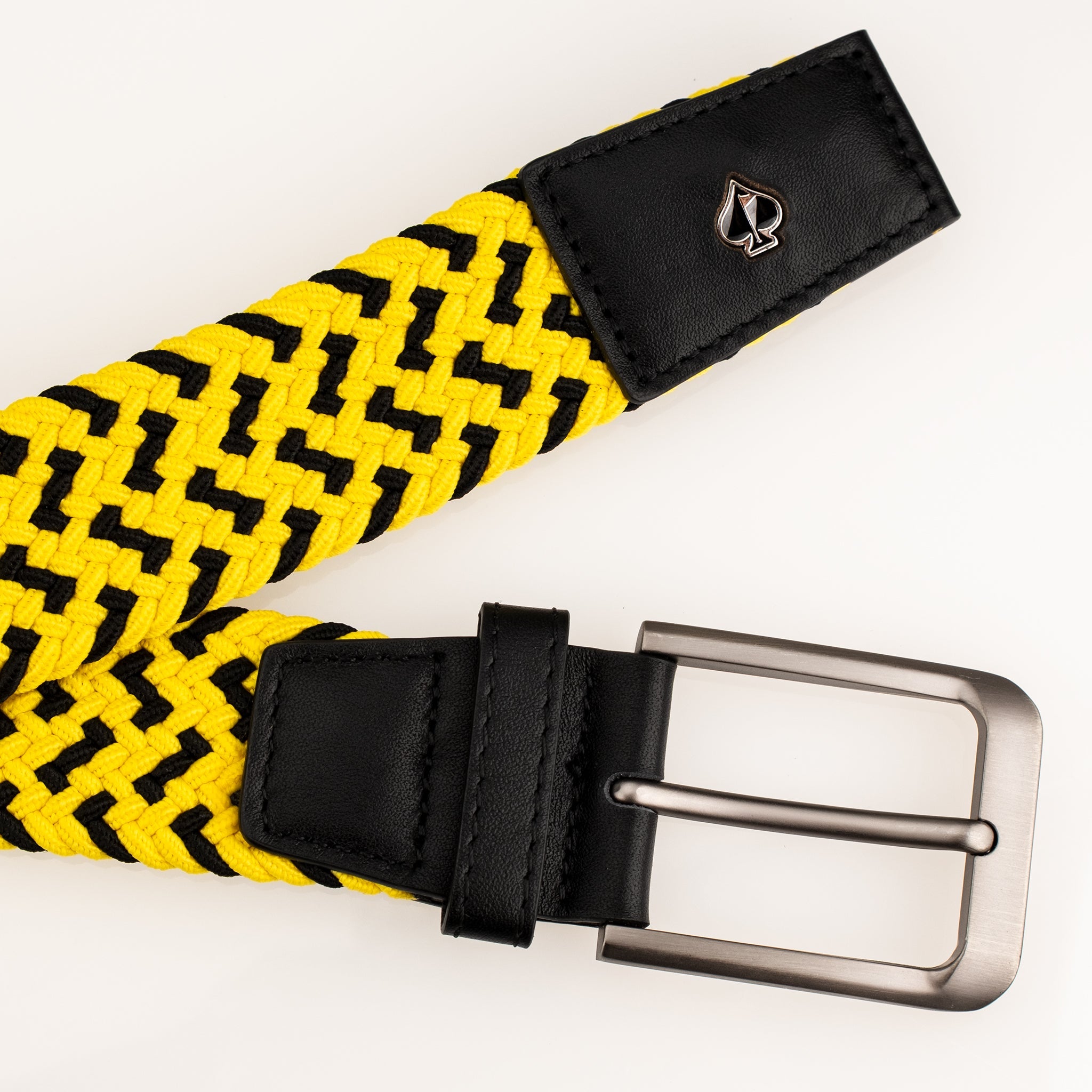 Bold yellow and black woven belt with a sleek metal buckle, featuring a stylish logo patch. Perfect for golfers.