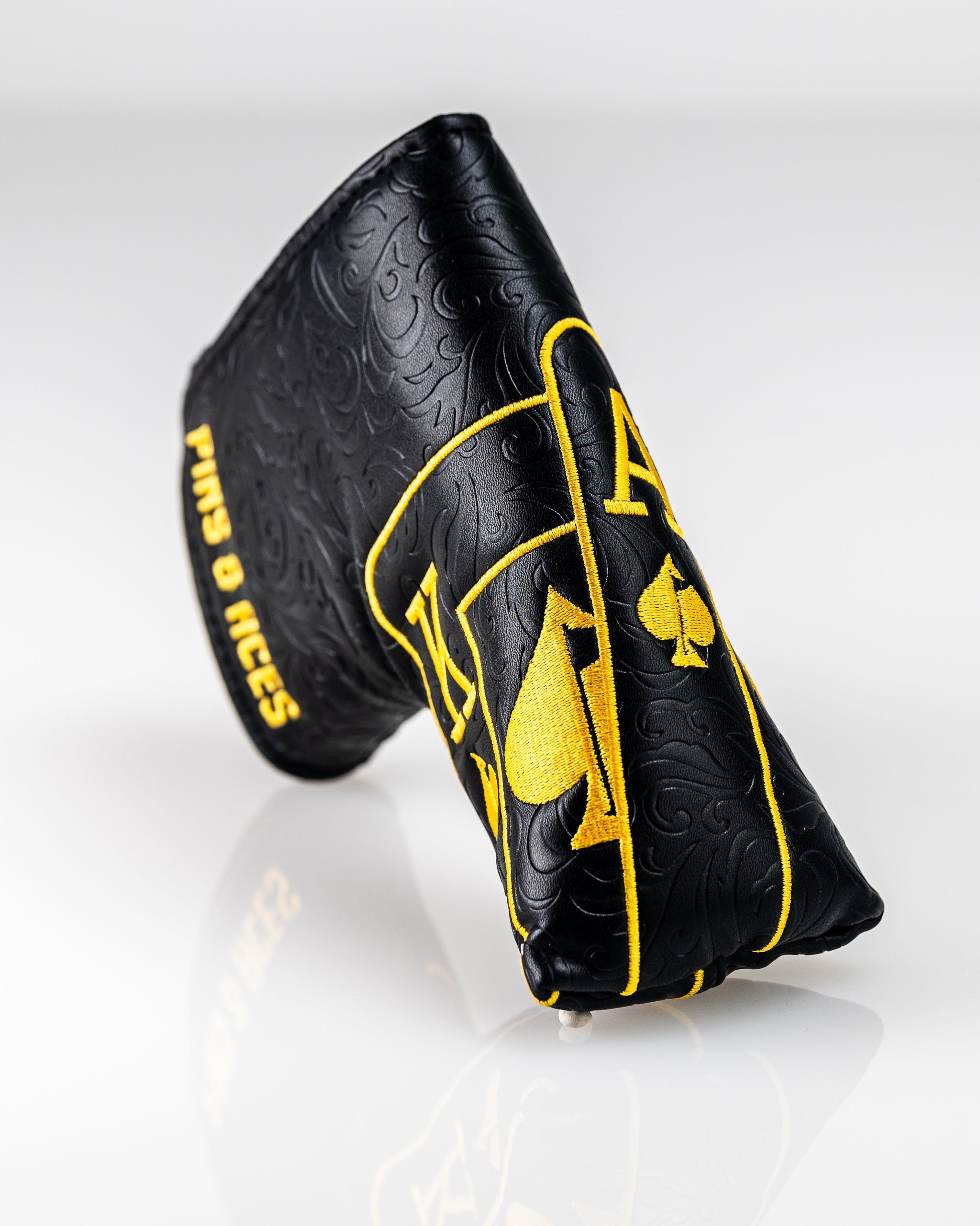 Black and gold Ace of Spades blade putter cover with embossed design, perfect for stylish golfers seeking standout accessories.