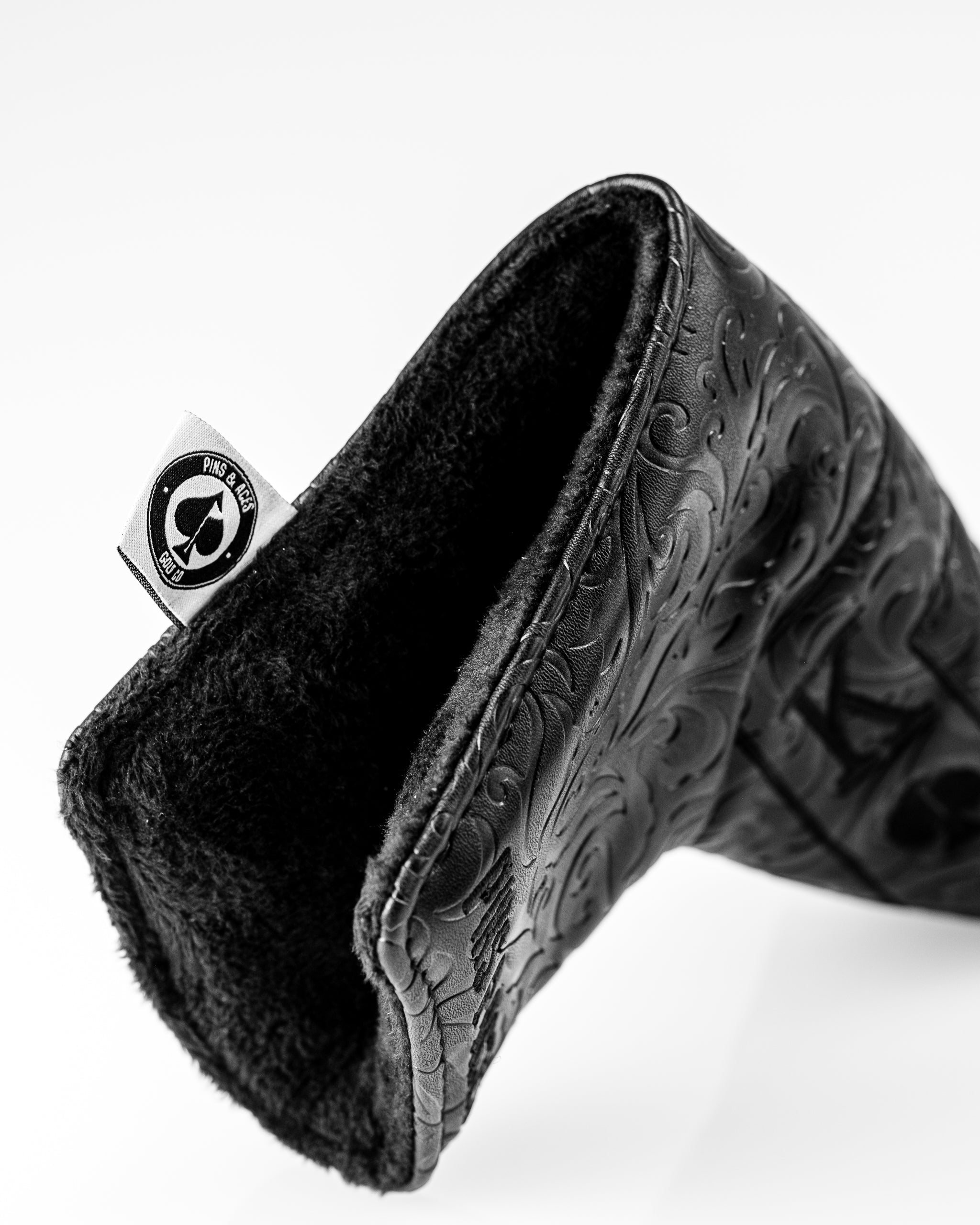 Blackout Ace of Spades blade putter cover featuring intricate embossed design and soft interior lining for protection.