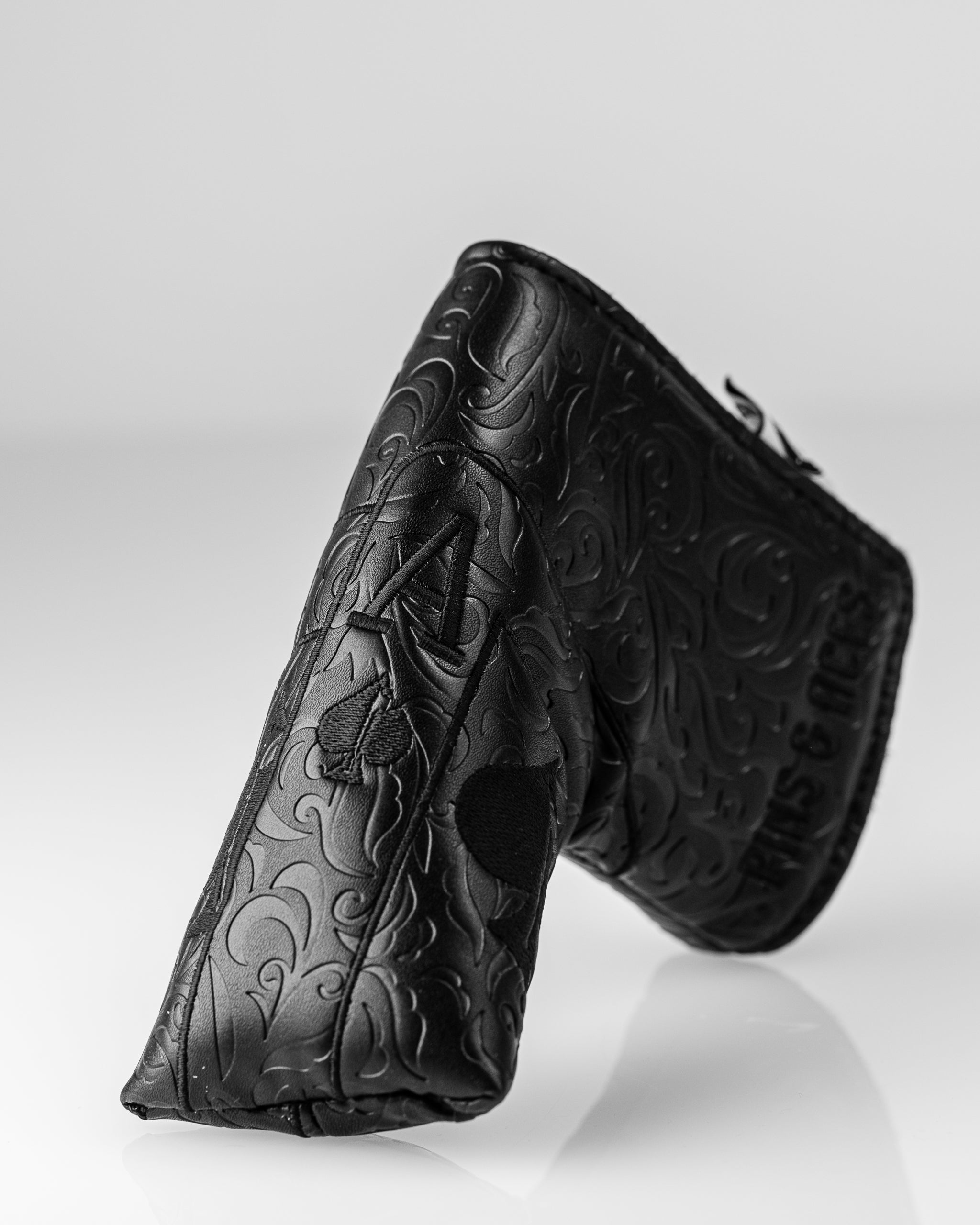 Blackout Ace of Spades blade putter cover featuring intricate embossed design and bold branding for stylish golf protection.