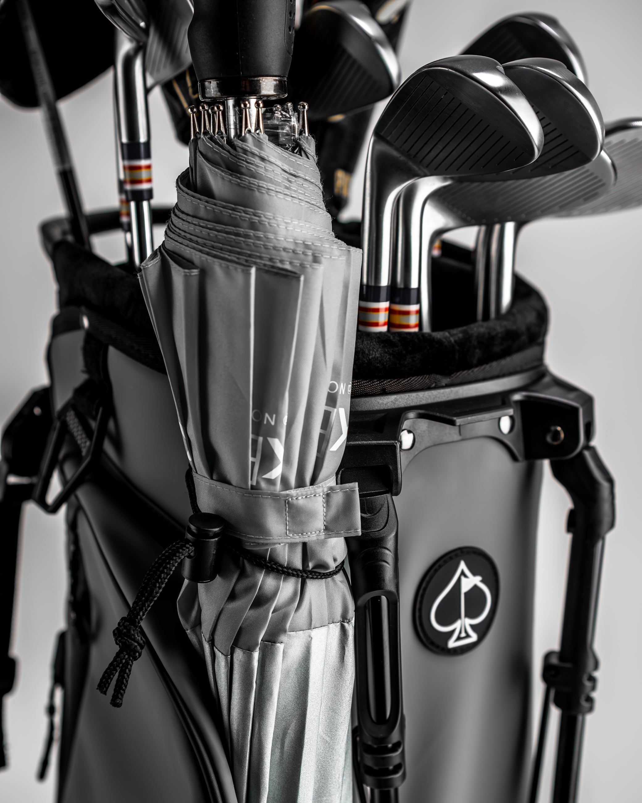 Stylish Player Preferred Golf Bag in Flat Ash with golf clubs and an umbrella, designed for golfers seeking standout performance.