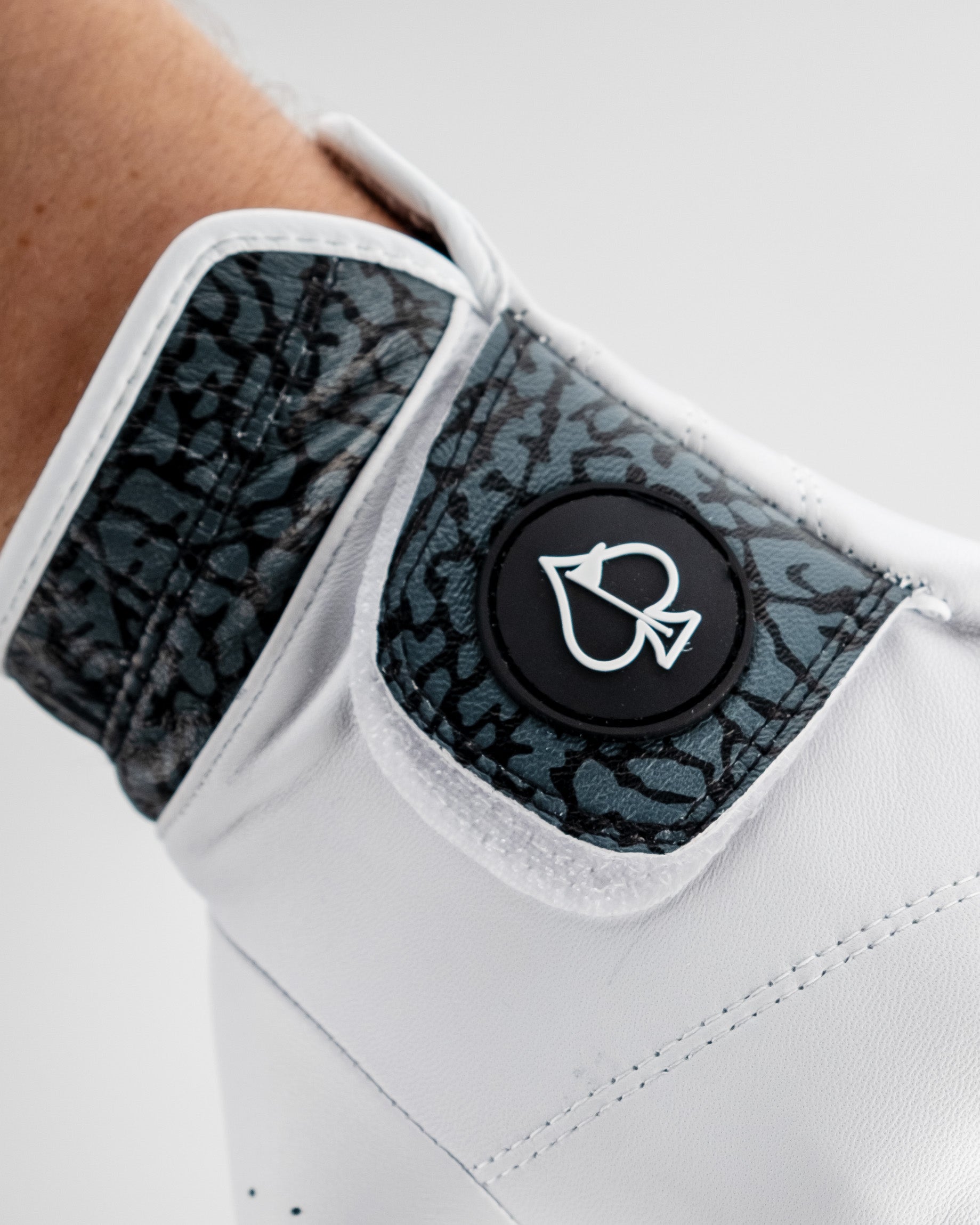 Premium Tour Glove featuring a stylish elephant print cuff and a sleek logo, designed for golfers seeking bold accessories.