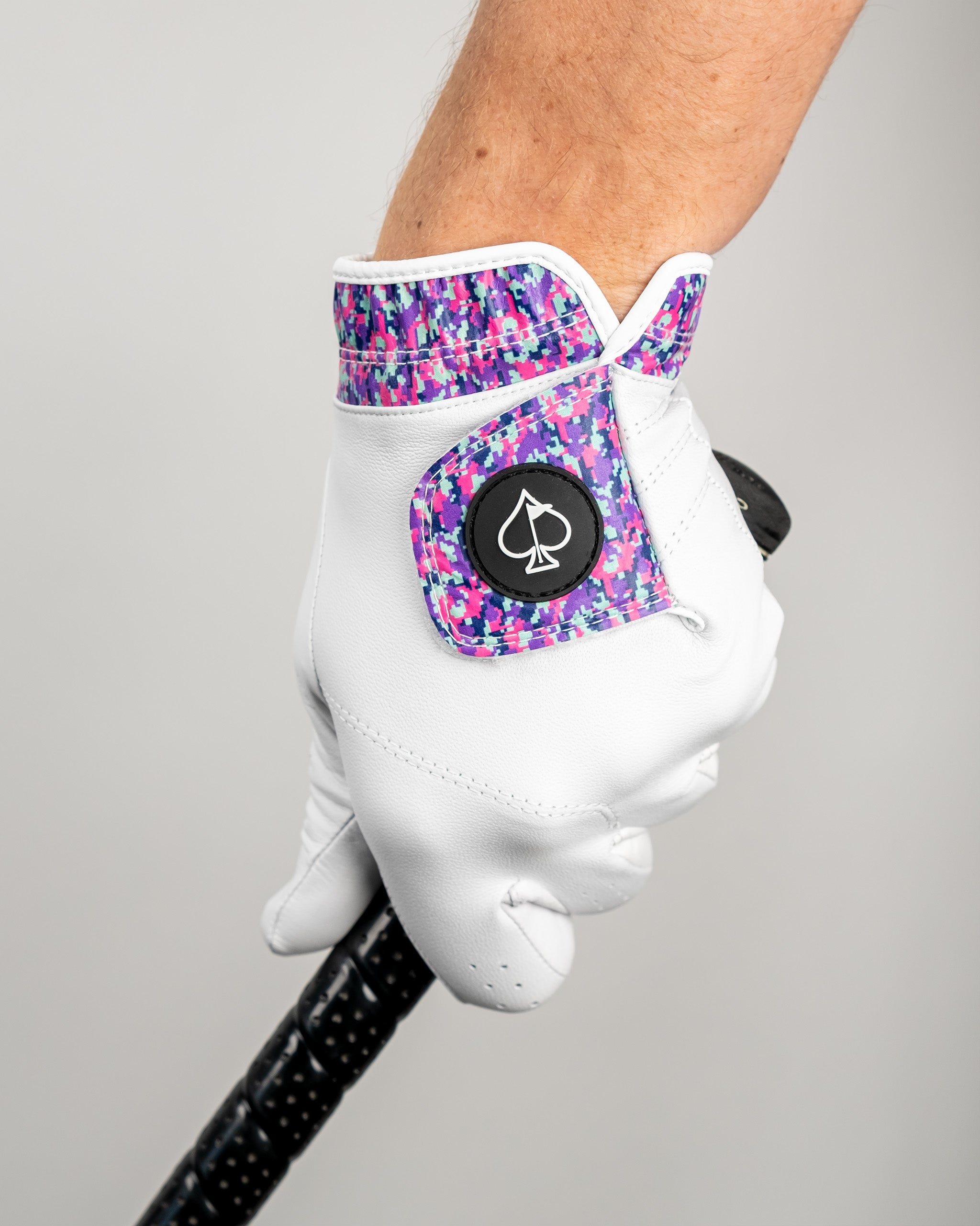 Premium Tour Glove in vivid camo design, featuring a colorful cuff and a sleek white palm, ideal for stylish golfers.