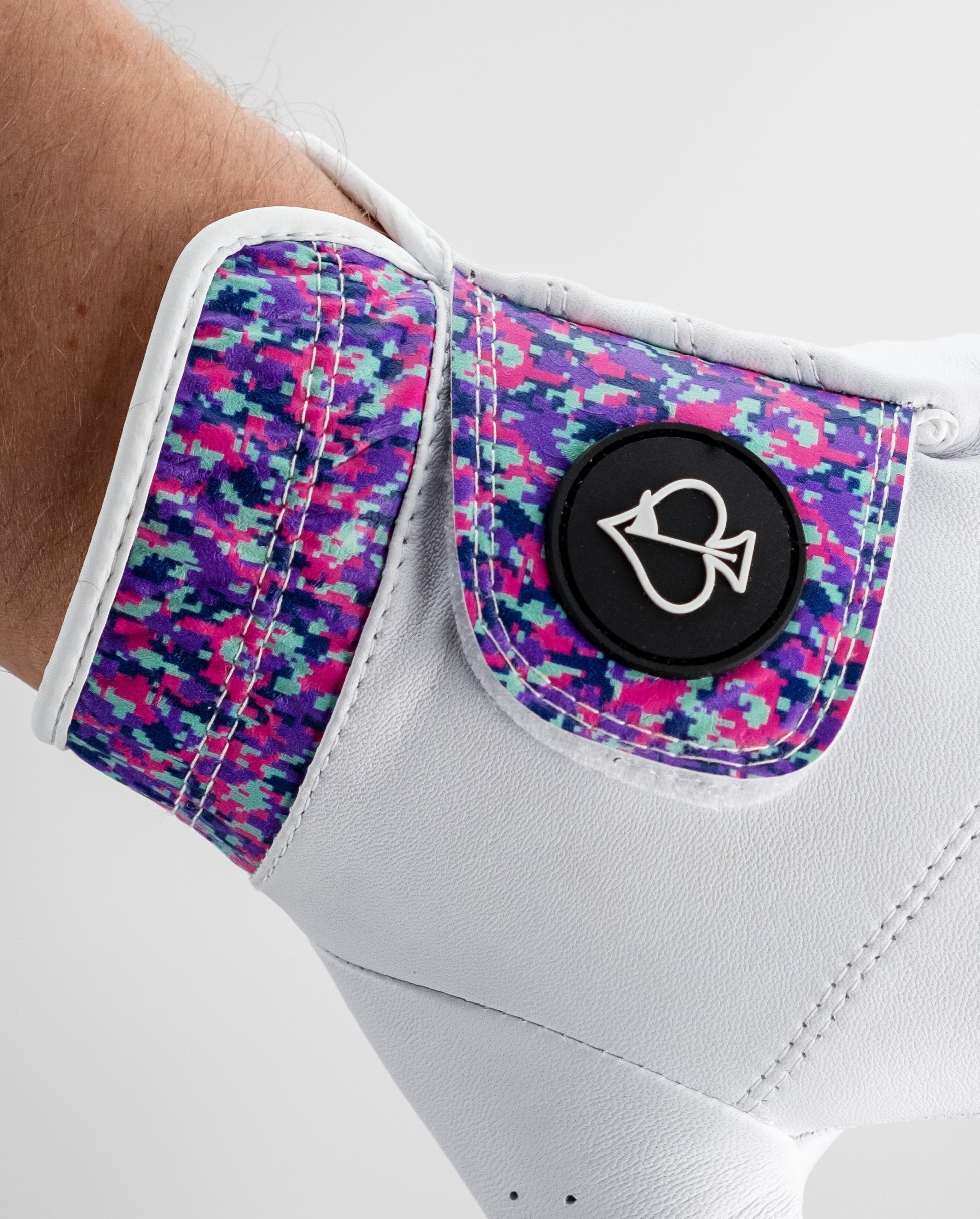 Premium Tour Glove in vivid camo features a colorful cuff and sleek white palm, designed for standout performance on the golf course.