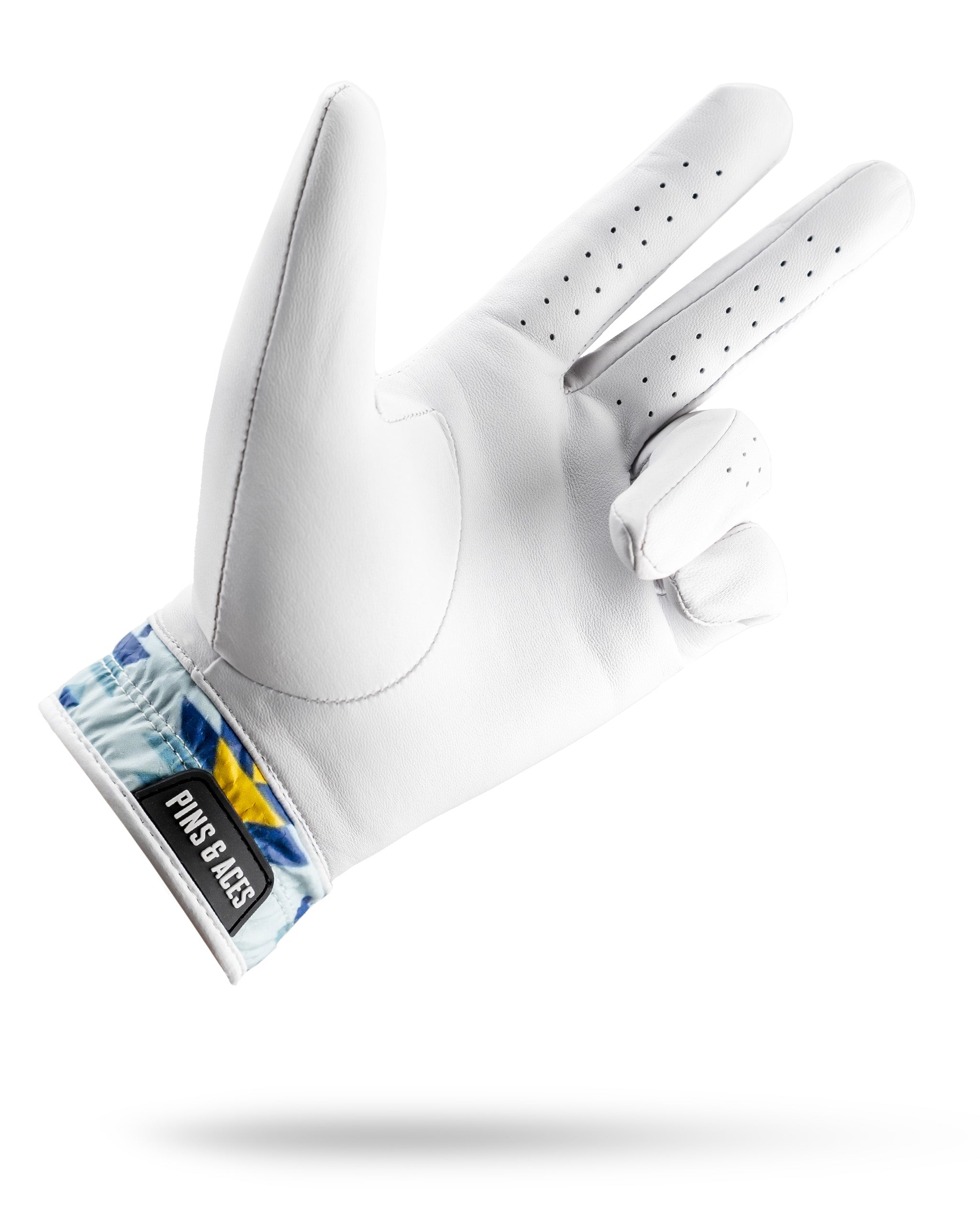 Premium Tour Glove in white leather with a colorful Southwest Sunset design on the cuff, ideal for stylish golfers.