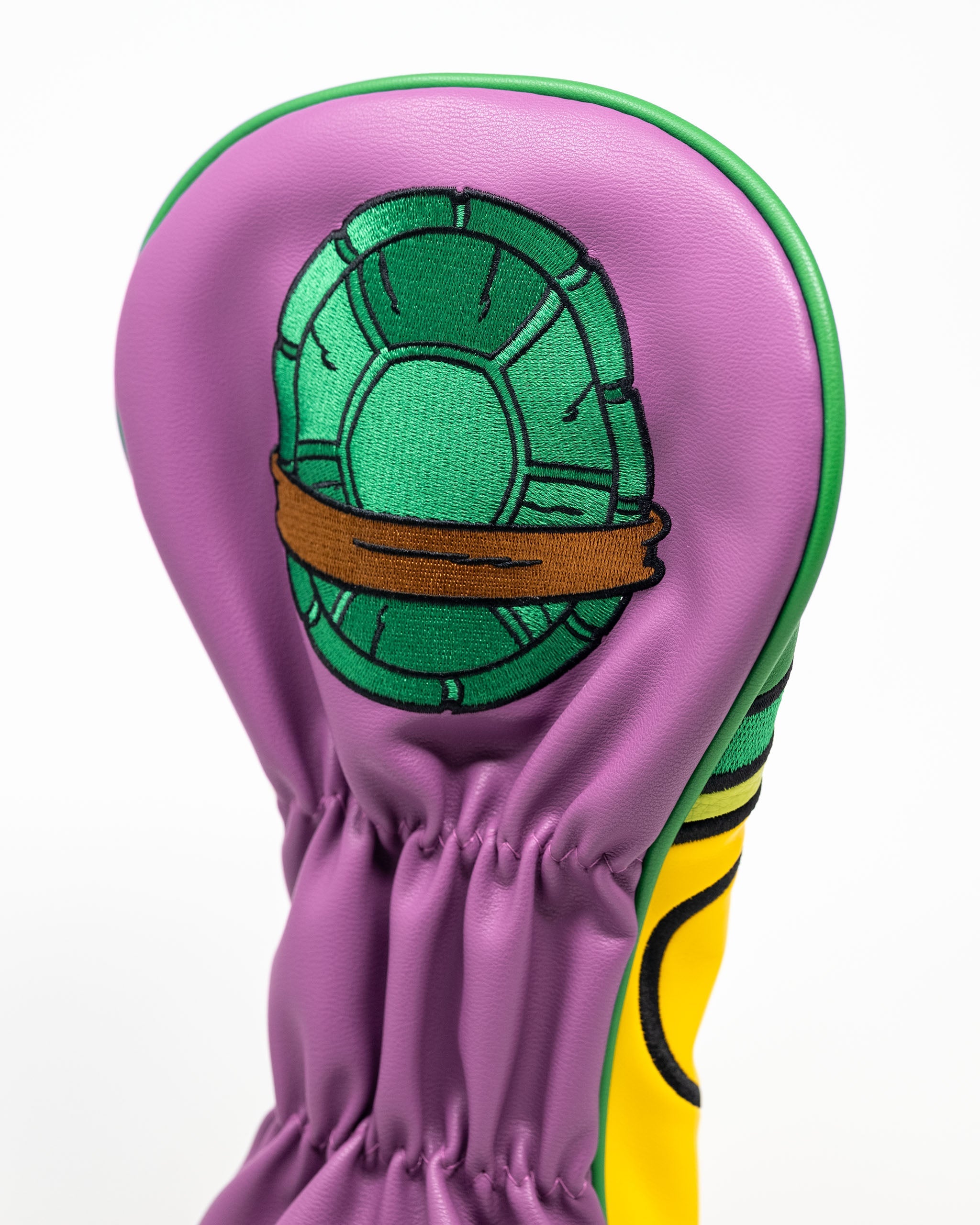 TMNT Donatello driver cover featuring a vibrant purple design with a turtle shell graphic, perfect for golf enthusiasts.