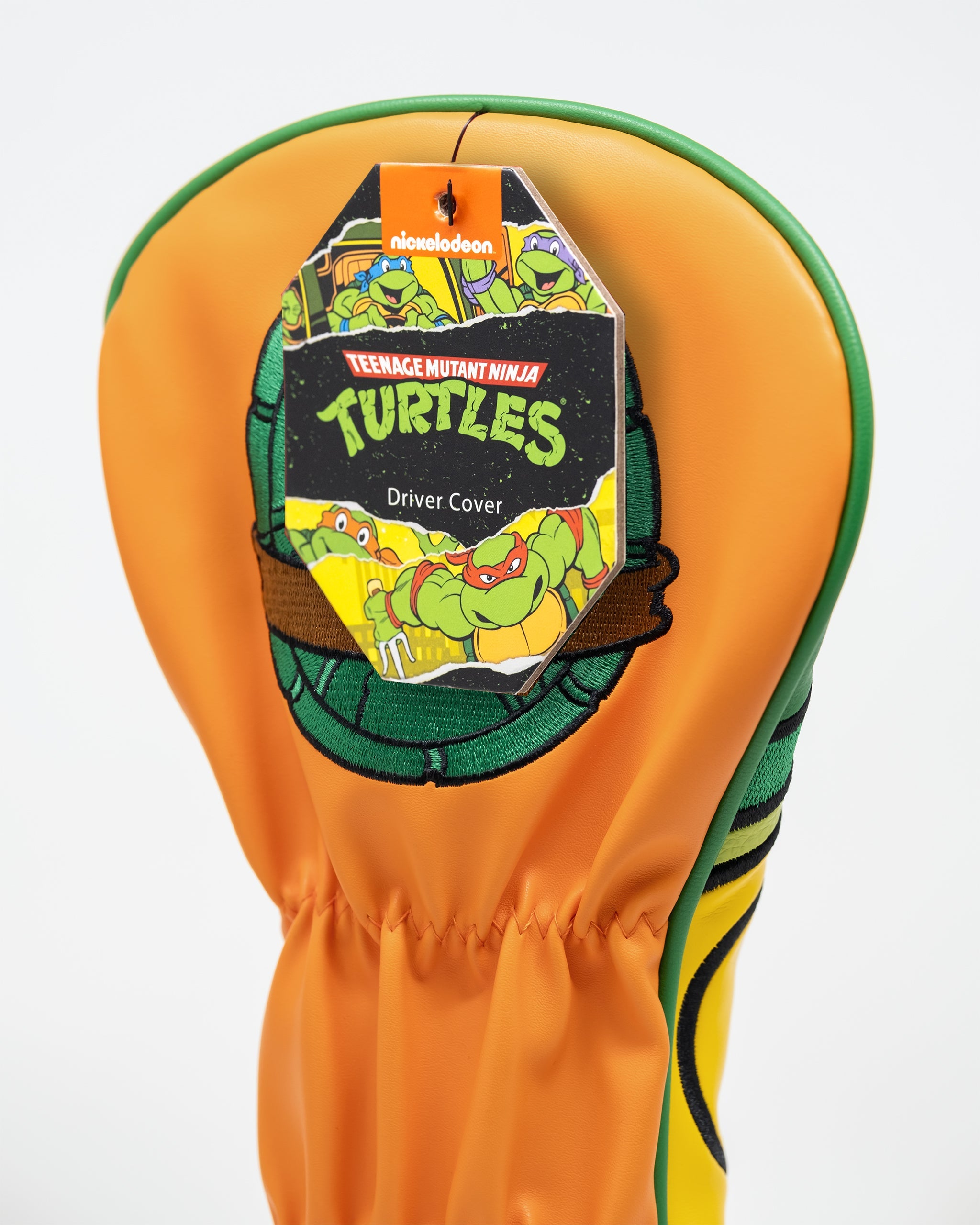 TMNT Michelangelo driver cover featuring vibrant orange and green design with character graphics for golf enthusiasts.