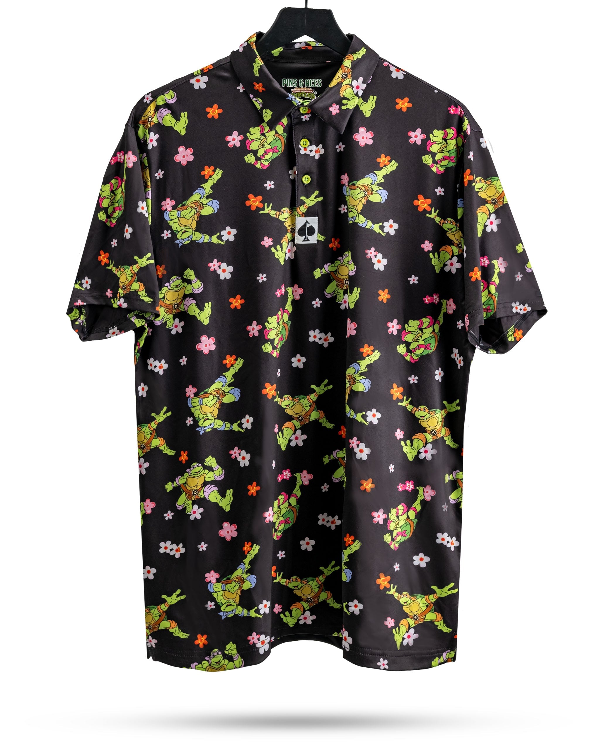 Bold black golf shirt featuring vibrant Teenage Mutant Ninja Turtles and floral patterns, perfect for standout style on the course.