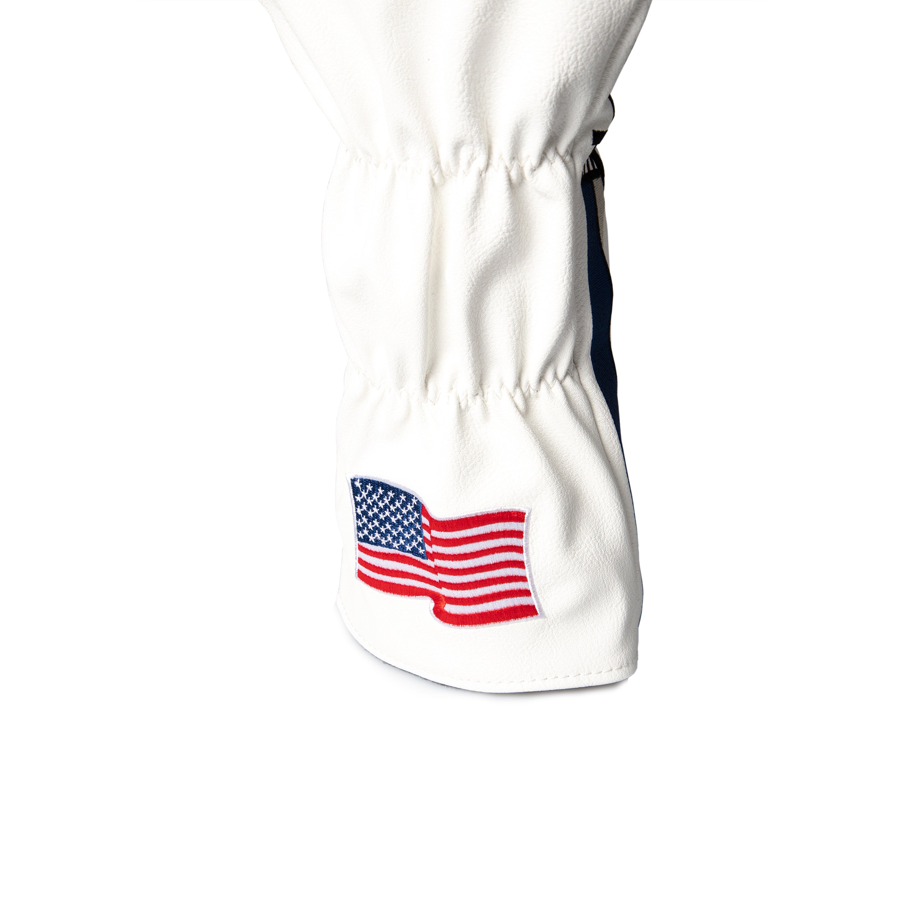 White golf driver cover featuring an embroidered American flag design, perfect for patriotic golfers.