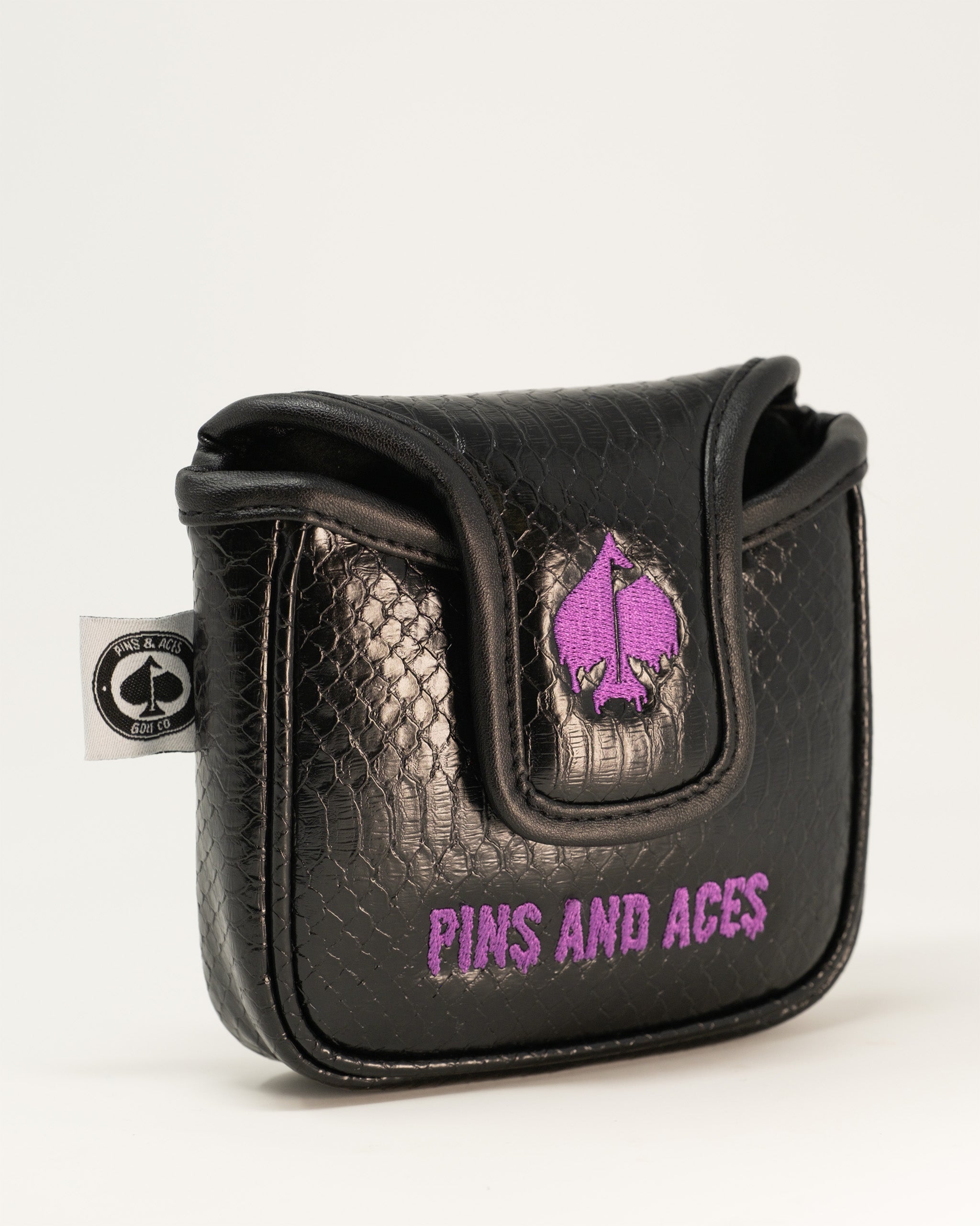 Black Venom mallet cover with a textured finish and purple embroidered logo, designed for stylish golf protection.