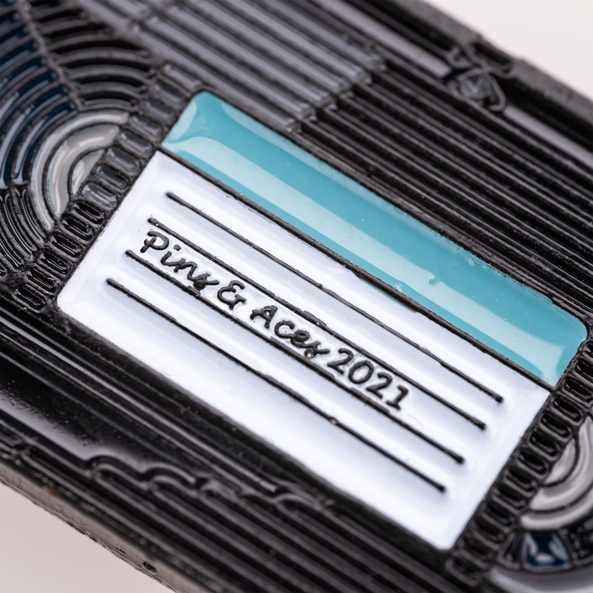 VHS ball marker designed to resemble a vintage tape, featuring the Pins and Aces logo and 2021 inscription.