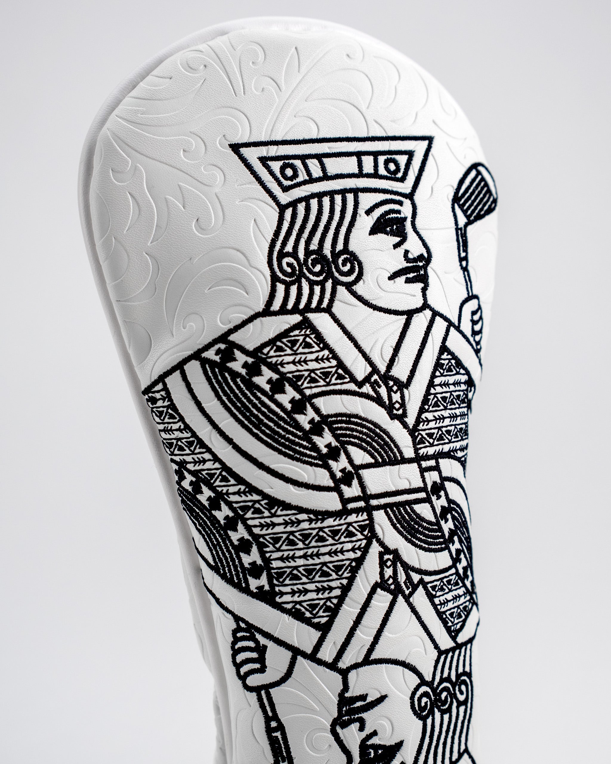 White hybrid golf club cover featuring a detailed Jack of Spades design in black on a textured white background.