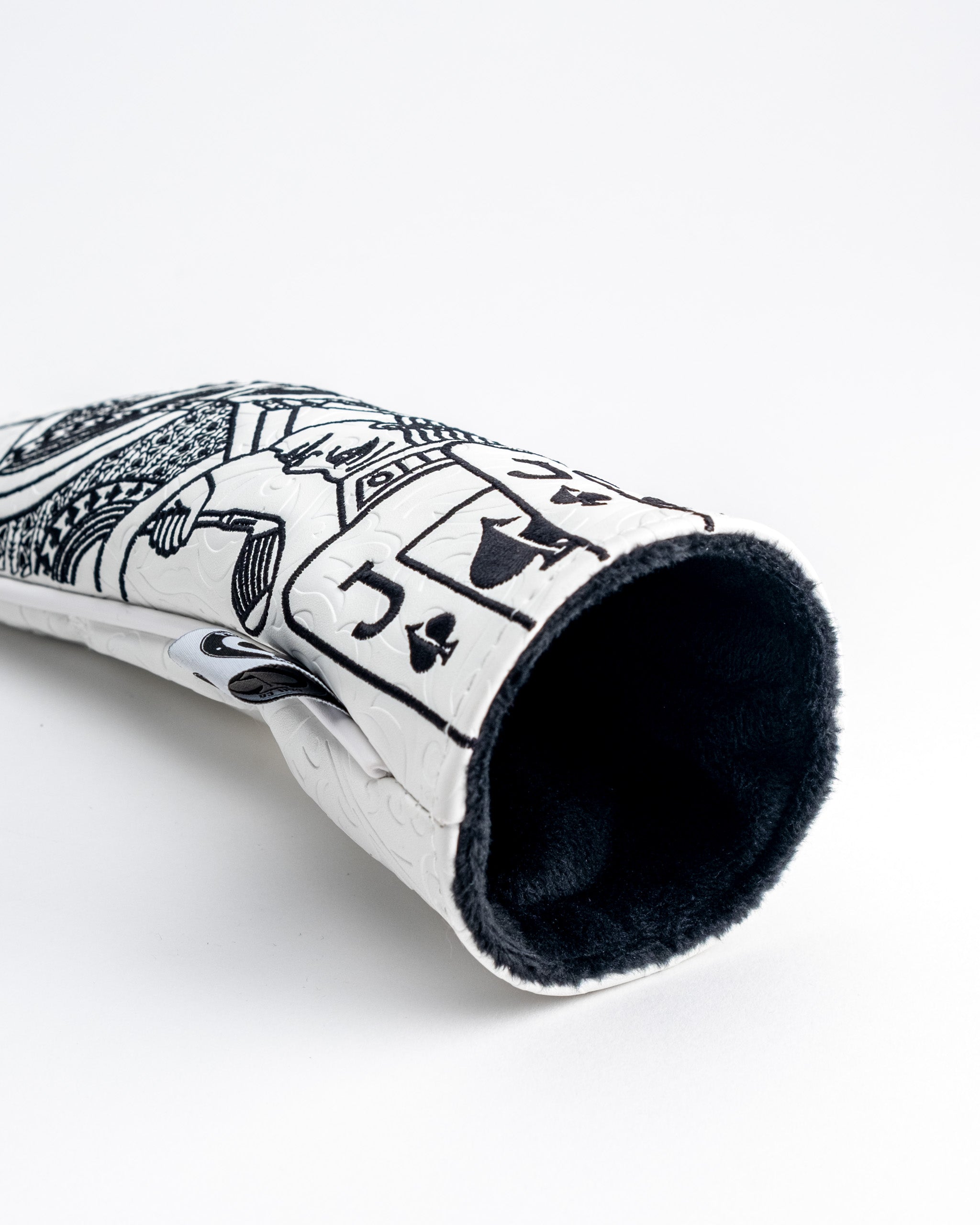 Stylish white hybrid golf headcover featuring a Jack of Spades design, with a soft black interior for protection.