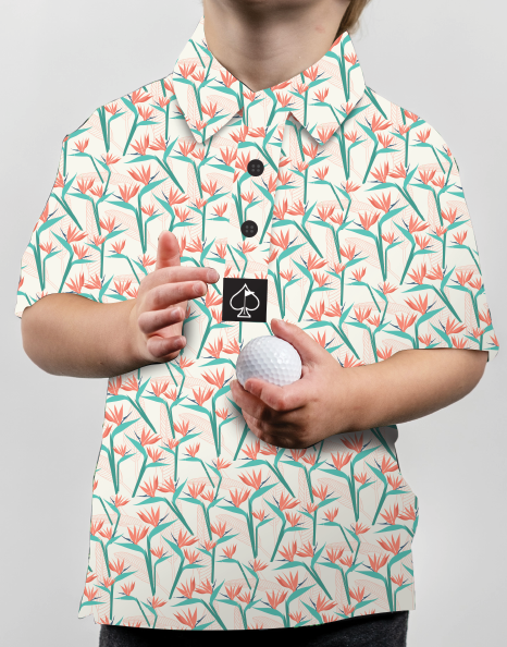 Youth Birds of Paradise golf shirt featuring a vibrant floral pattern, perfect for stylish young golfers.