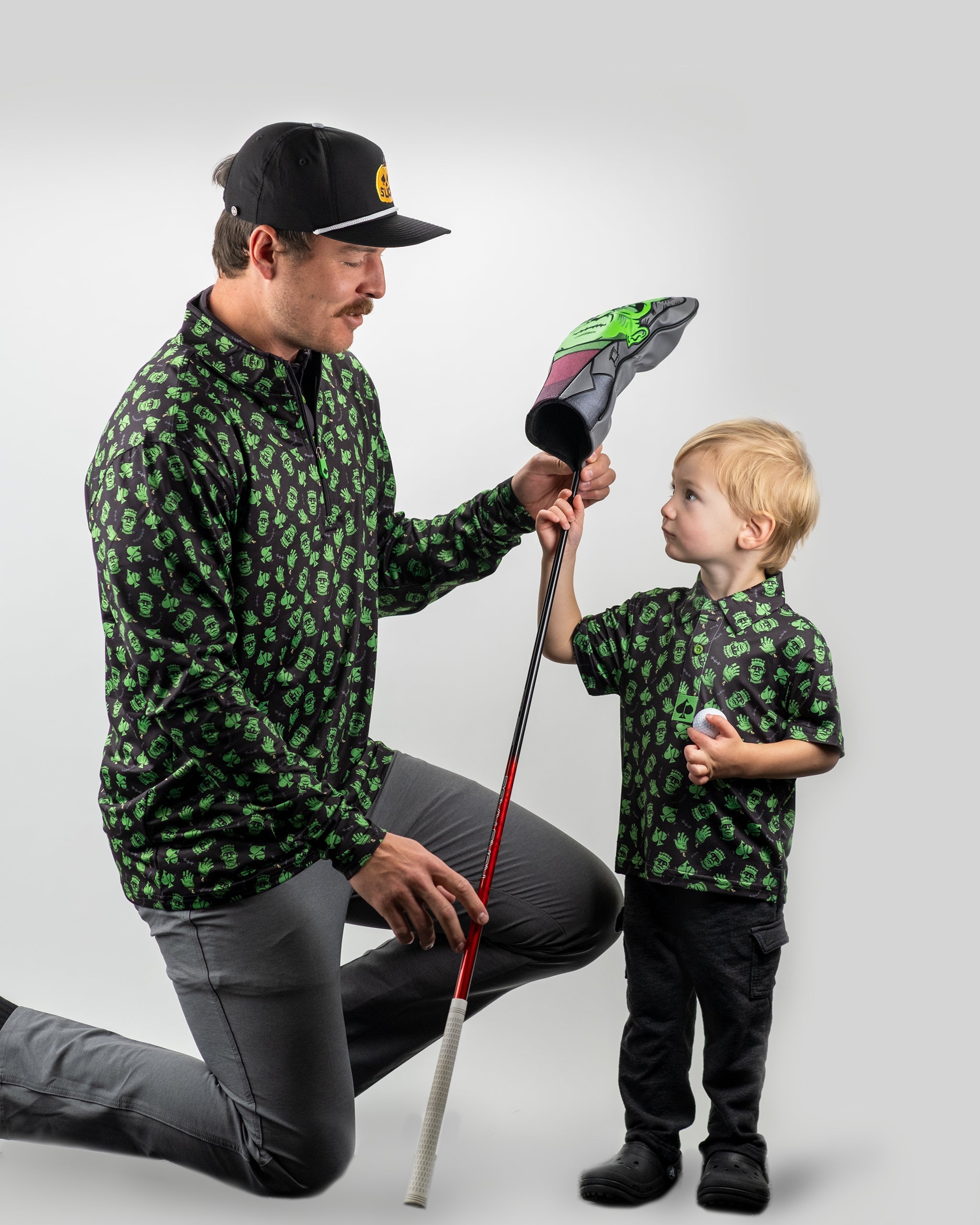 Youth Frankenstein Polo features a playful green monster design, perfect for young golfers looking to stand out on the course.