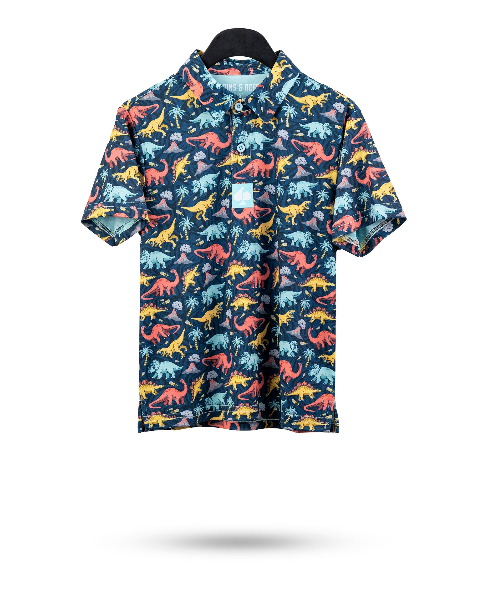 Colorful youth polo featuring a vibrant dinosaur print on a dark background, perfect for young golf enthusiasts.