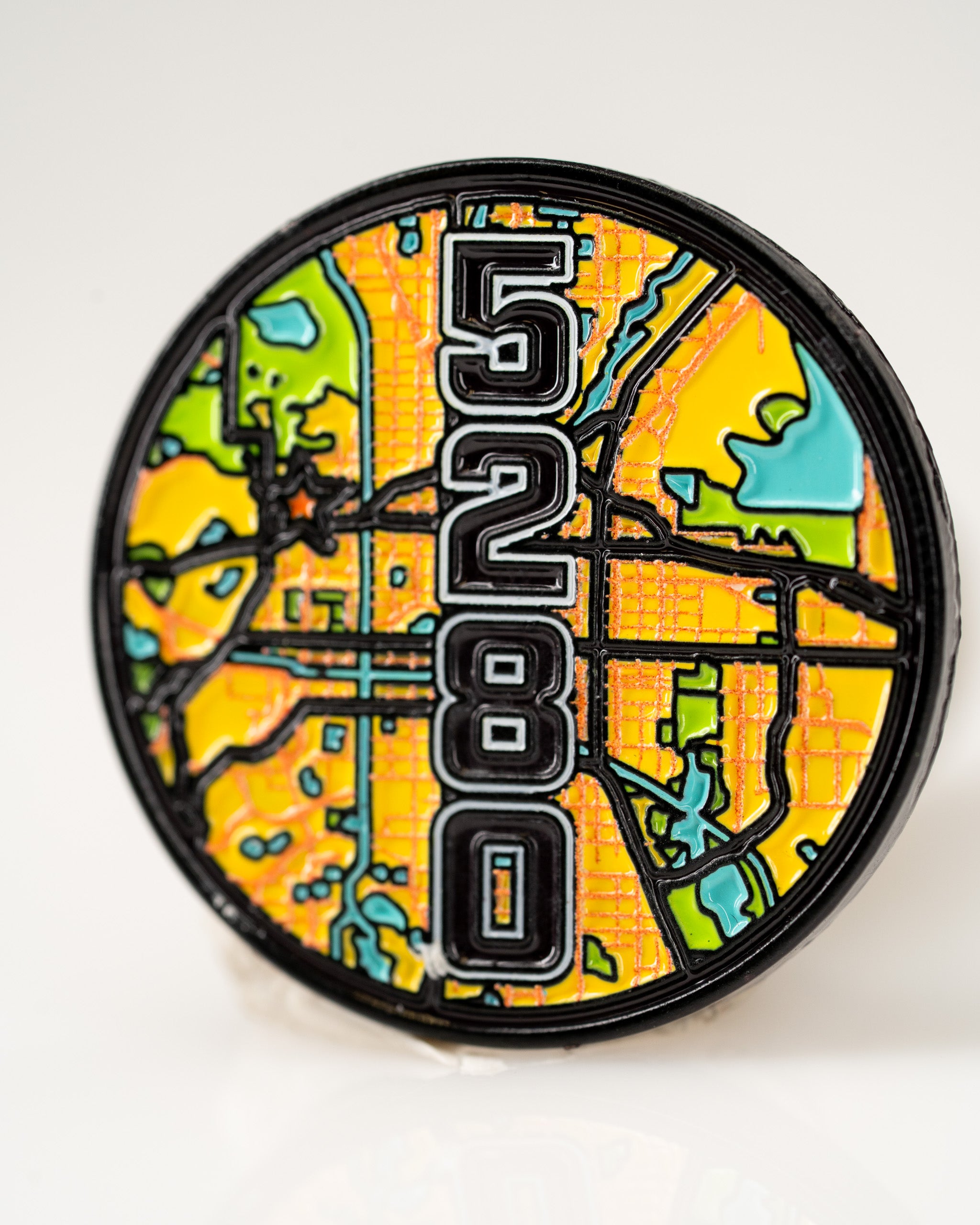 Bold 5280 ball marker featuring a vibrant map design, perfect for golfers looking to make a statement on the course.