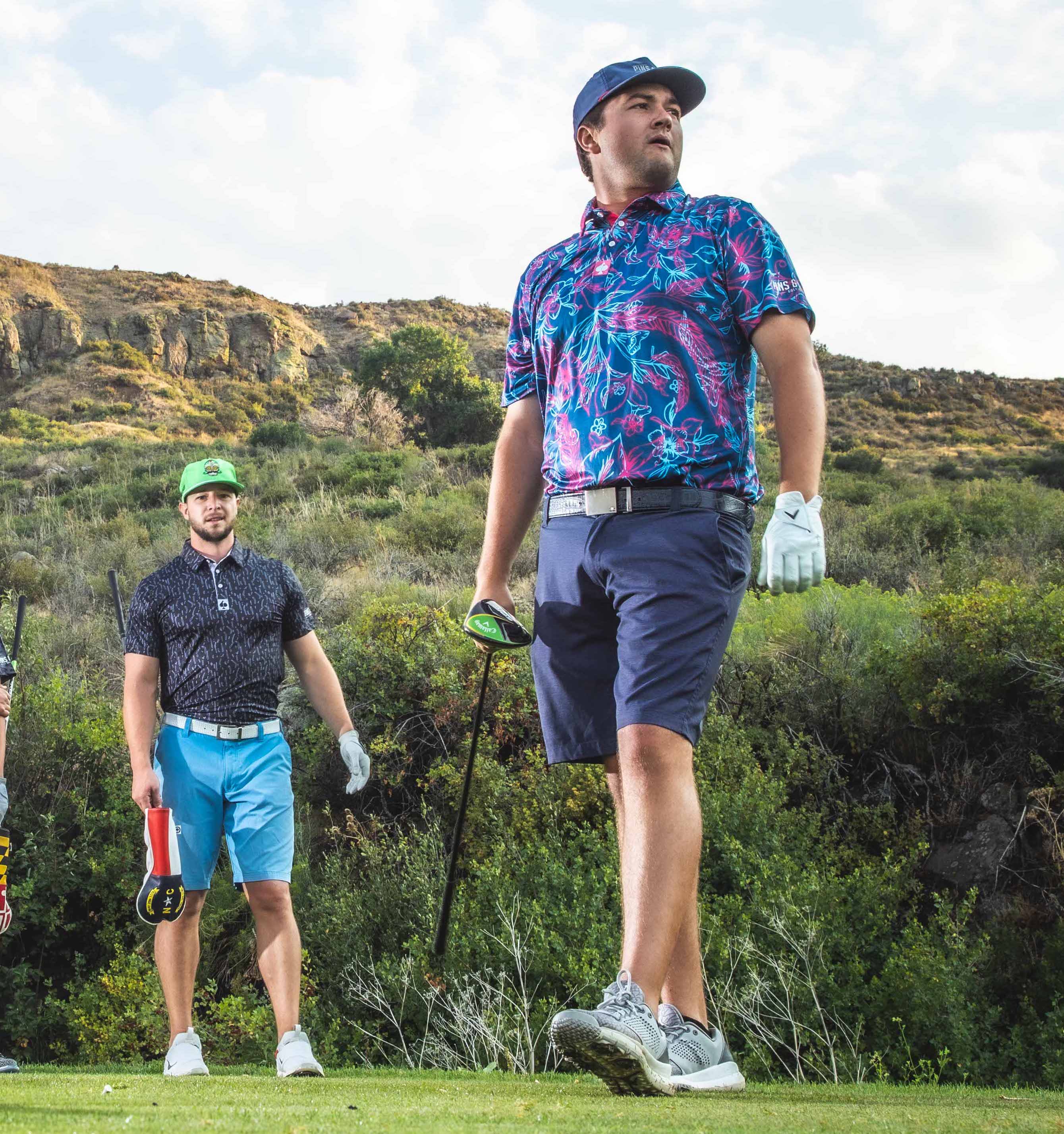 Bold golf apparel featuring a vibrant Cabo Colada shirt with tropical patterns, worn on the course by stylish golfers.