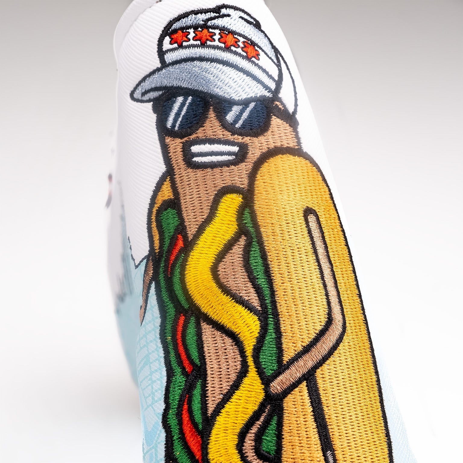 Bold Chicago Dog blade putter cover featuring a cartoon hot dog character in sunglasses and a cap, perfect for unique golf style.