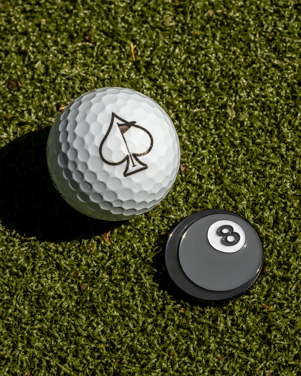 Magic 8 Ball golf ball marker featuring iconic eight-ball design, with a glossy finish and clear text for divination on the course.