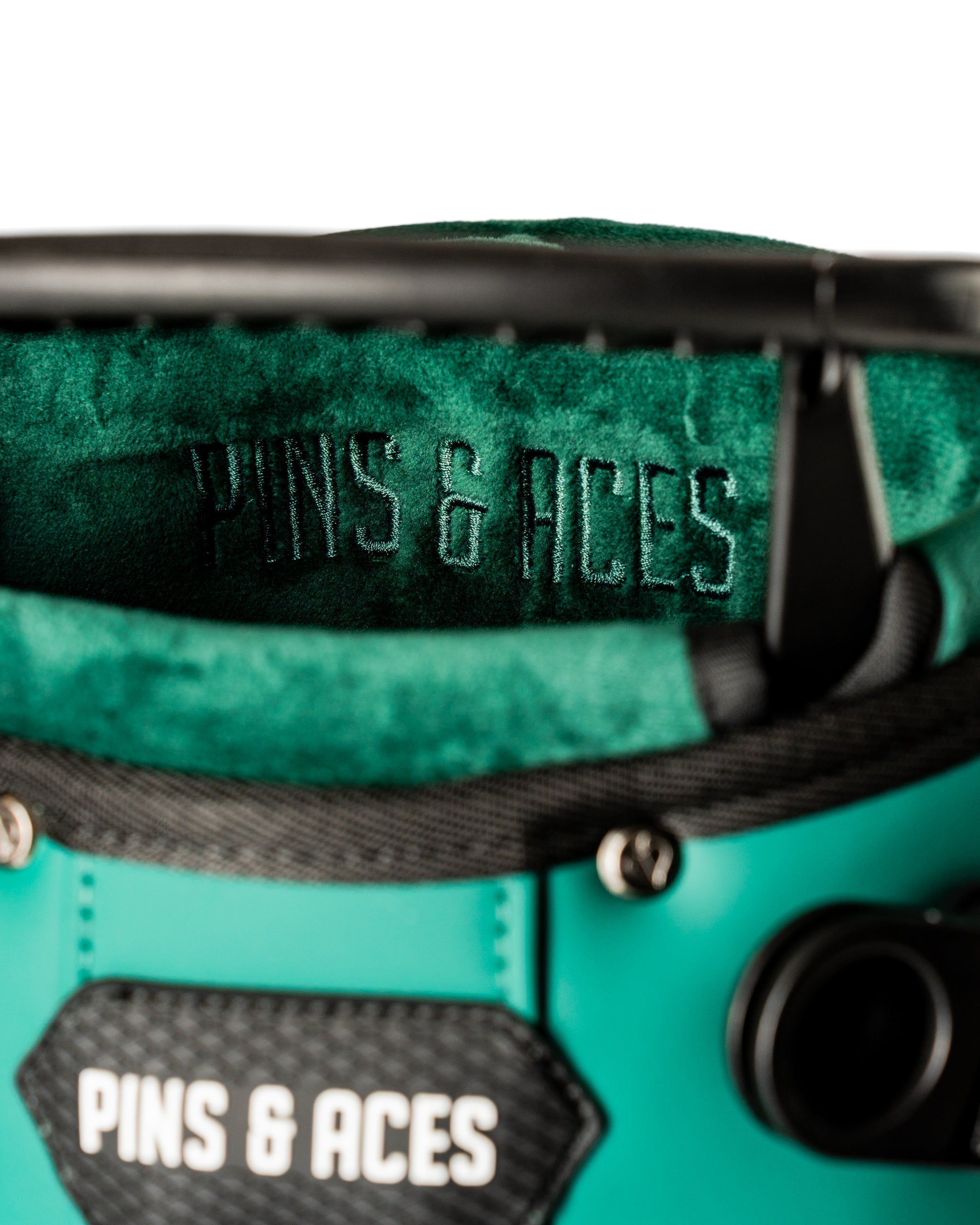 Interior view of the Player Preferred Golf Bag featuring a soft green lining and embossed Pins & Aces logo.