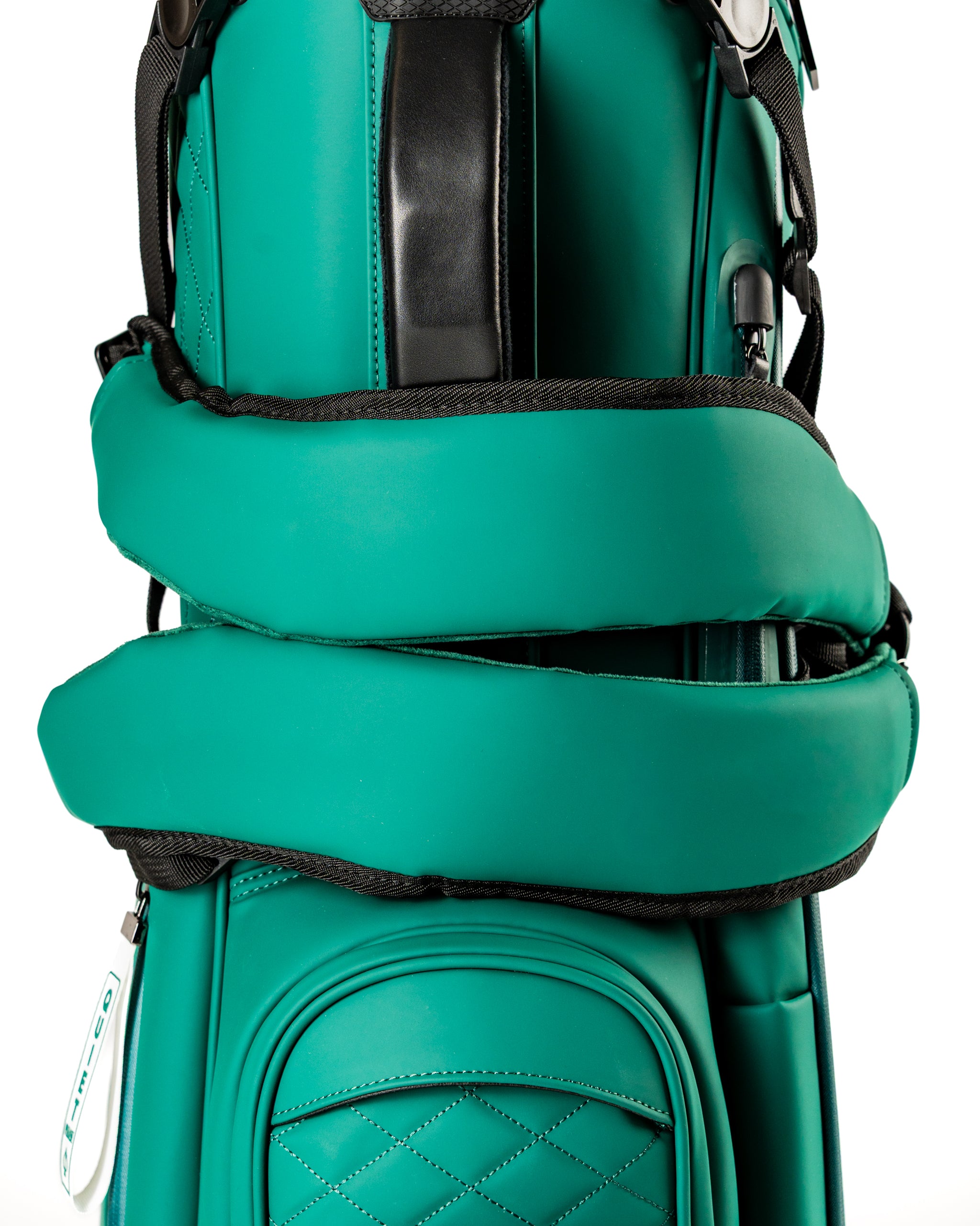 Close-up of the Player Preferred Golf Bag in teal, featuring padded straps and a sleek design for comfort on the course.