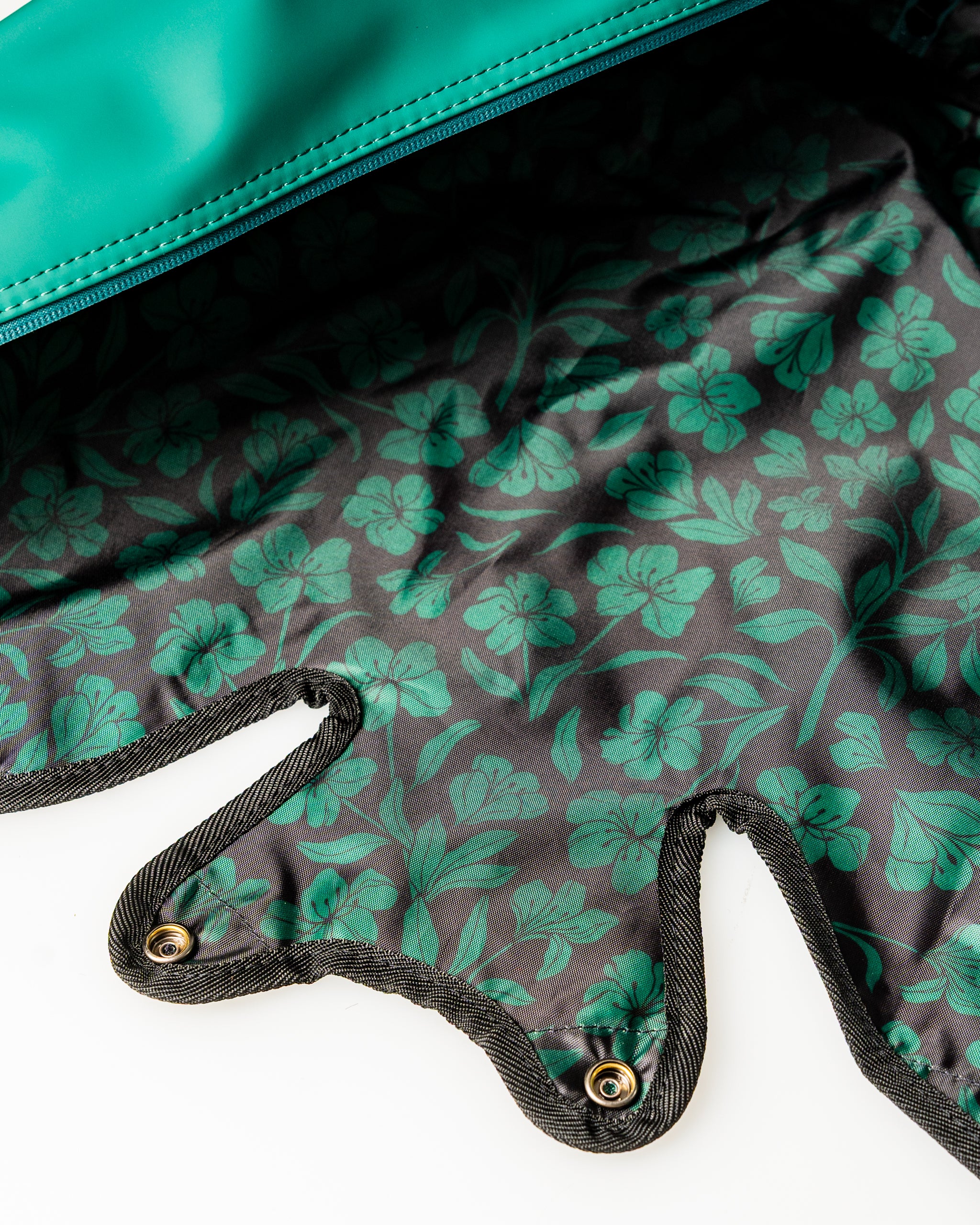 Interior view of the Player Preferred Golf Bag featuring a floral pattern in green on a black background.