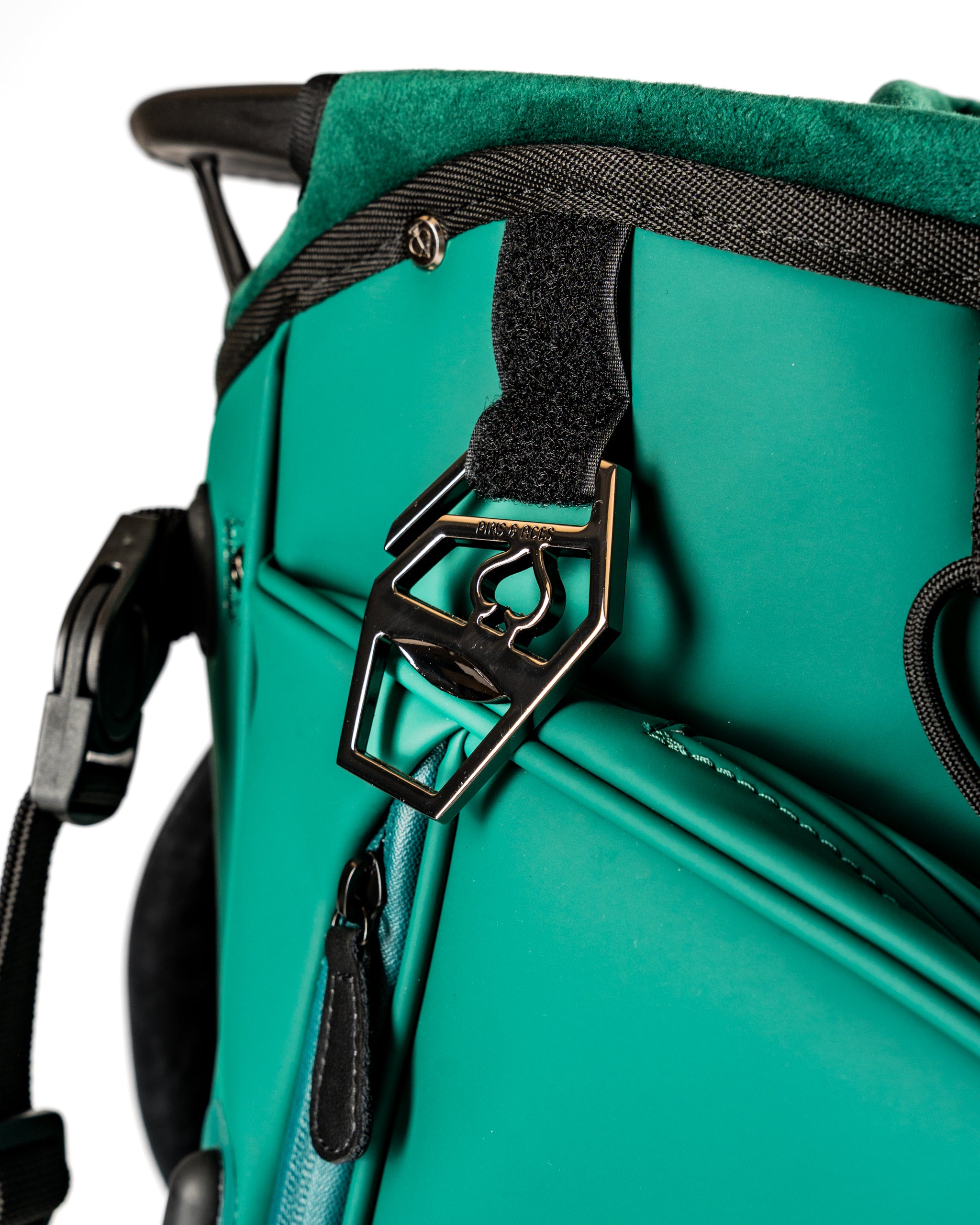Close-up of the Player Preferred Golf Bag featuring a unique green design and a stylish metal clip for accessories.