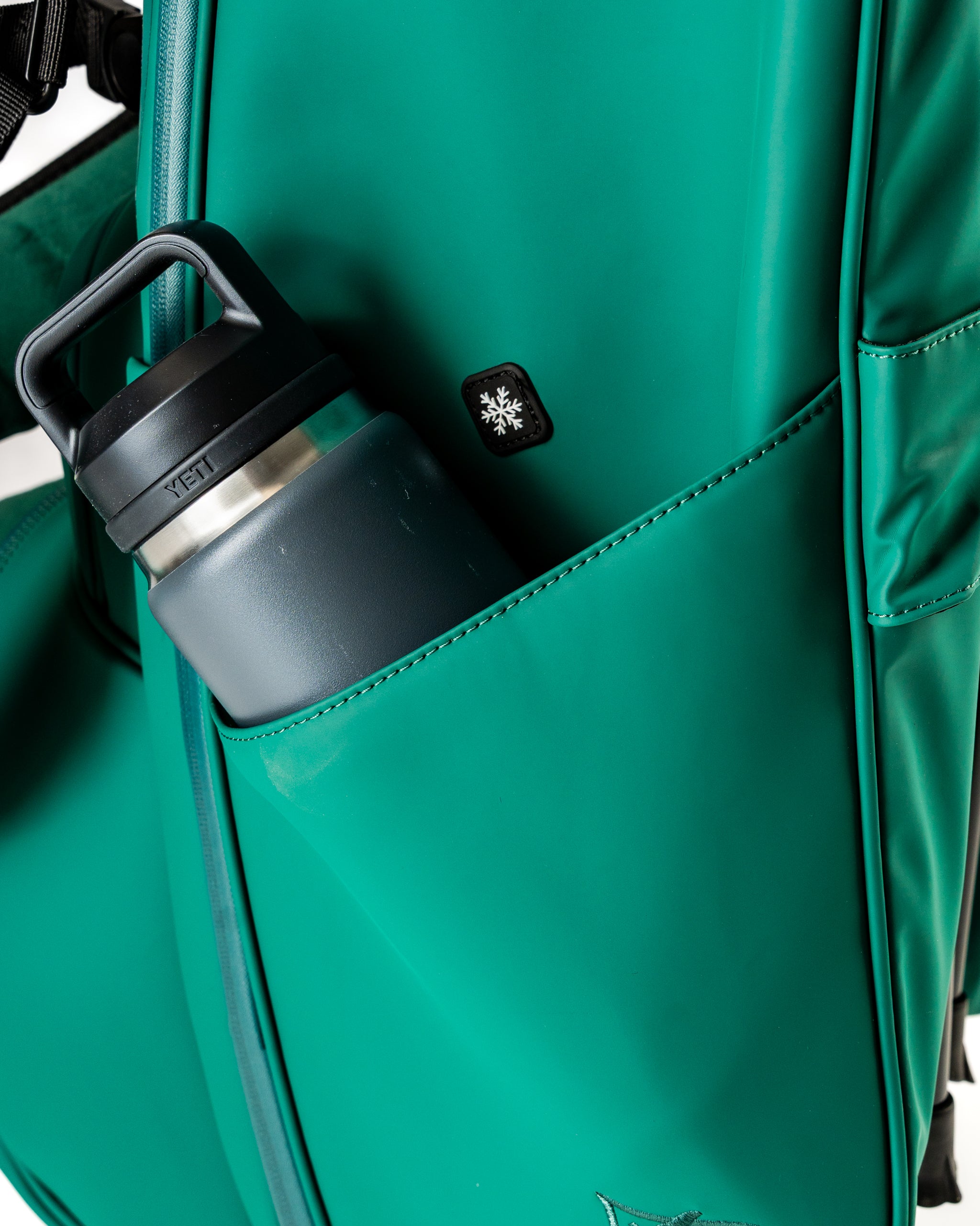 Player Preferred Golf Bag in vibrant green featuring a side pocket with a water bottle, designed for stylish golfers.