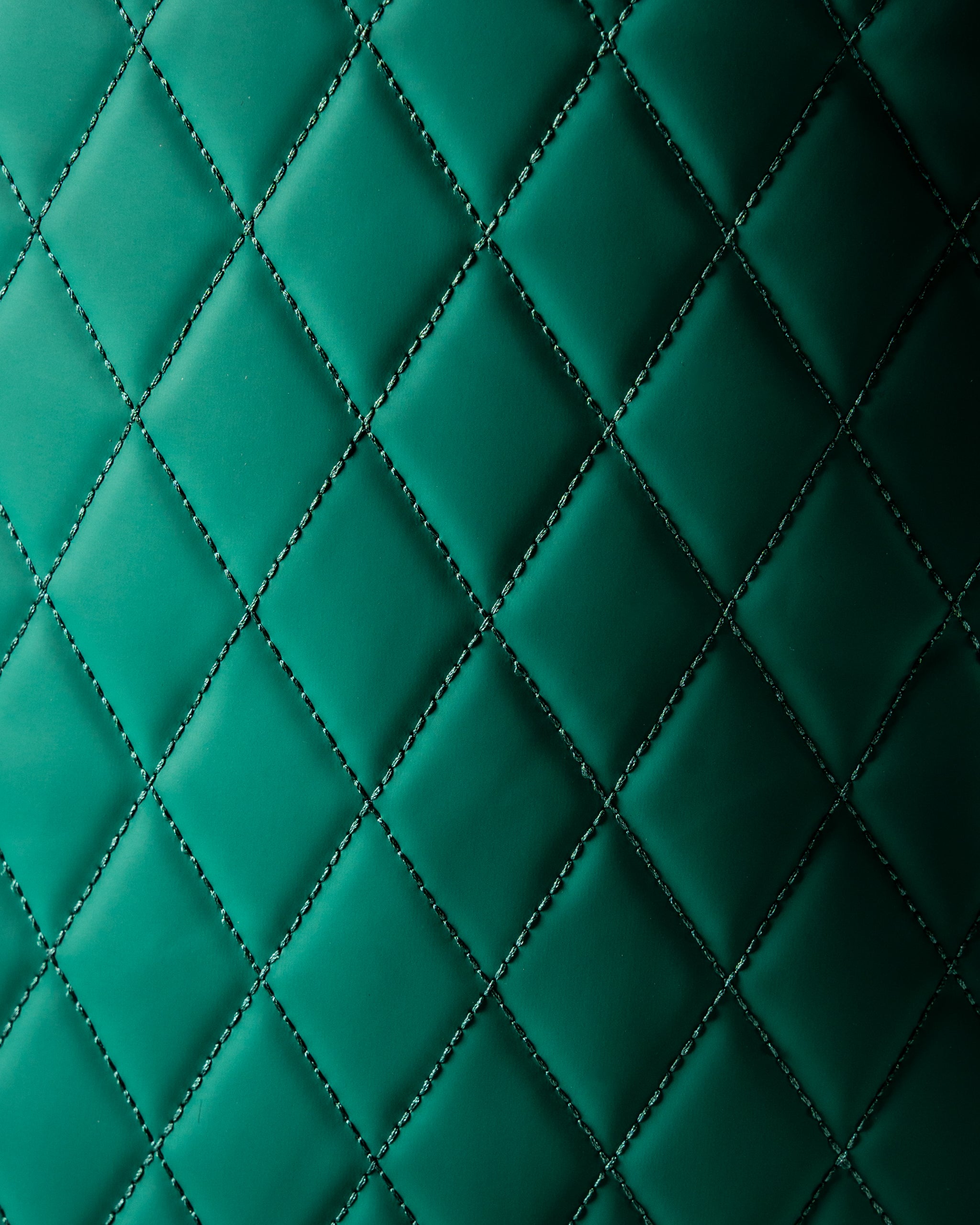 Quilted green texture of the Player Preferred Golf Bag, showcasing its stylish and durable design for golfers.