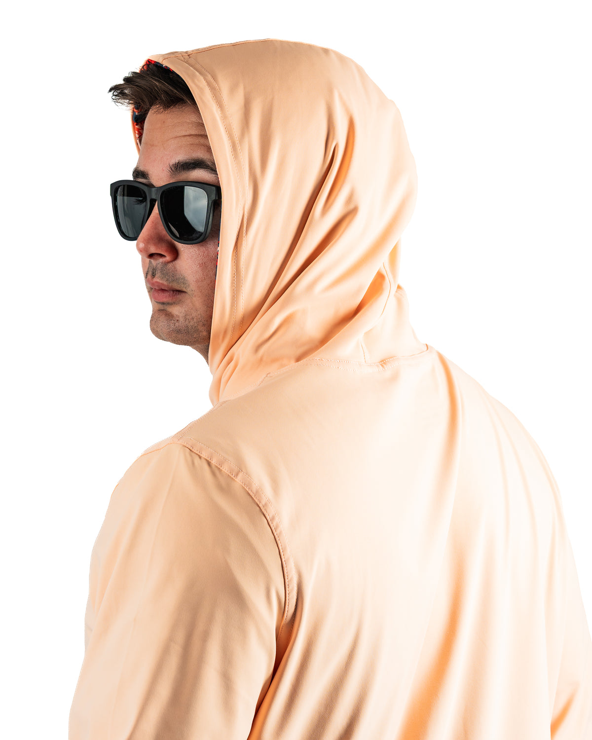 Performance Golf Hoodie in Autumn Leaves color, featuring a relaxed fit and hood, worn by a model with sunglasses.