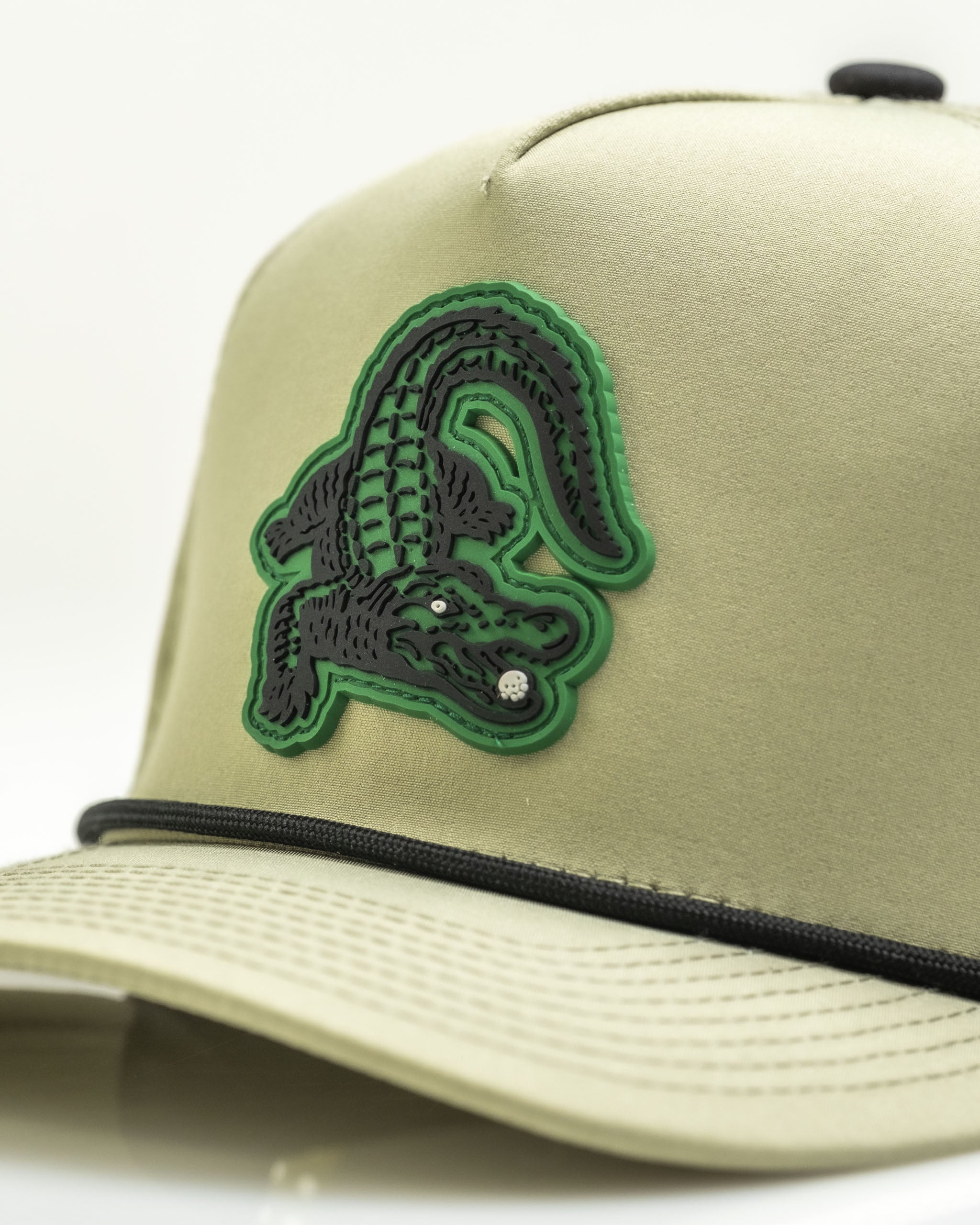 Gator Olive perforated rope hat featuring a bold green and black alligator logo on the front. Ideal for stylish golfers.