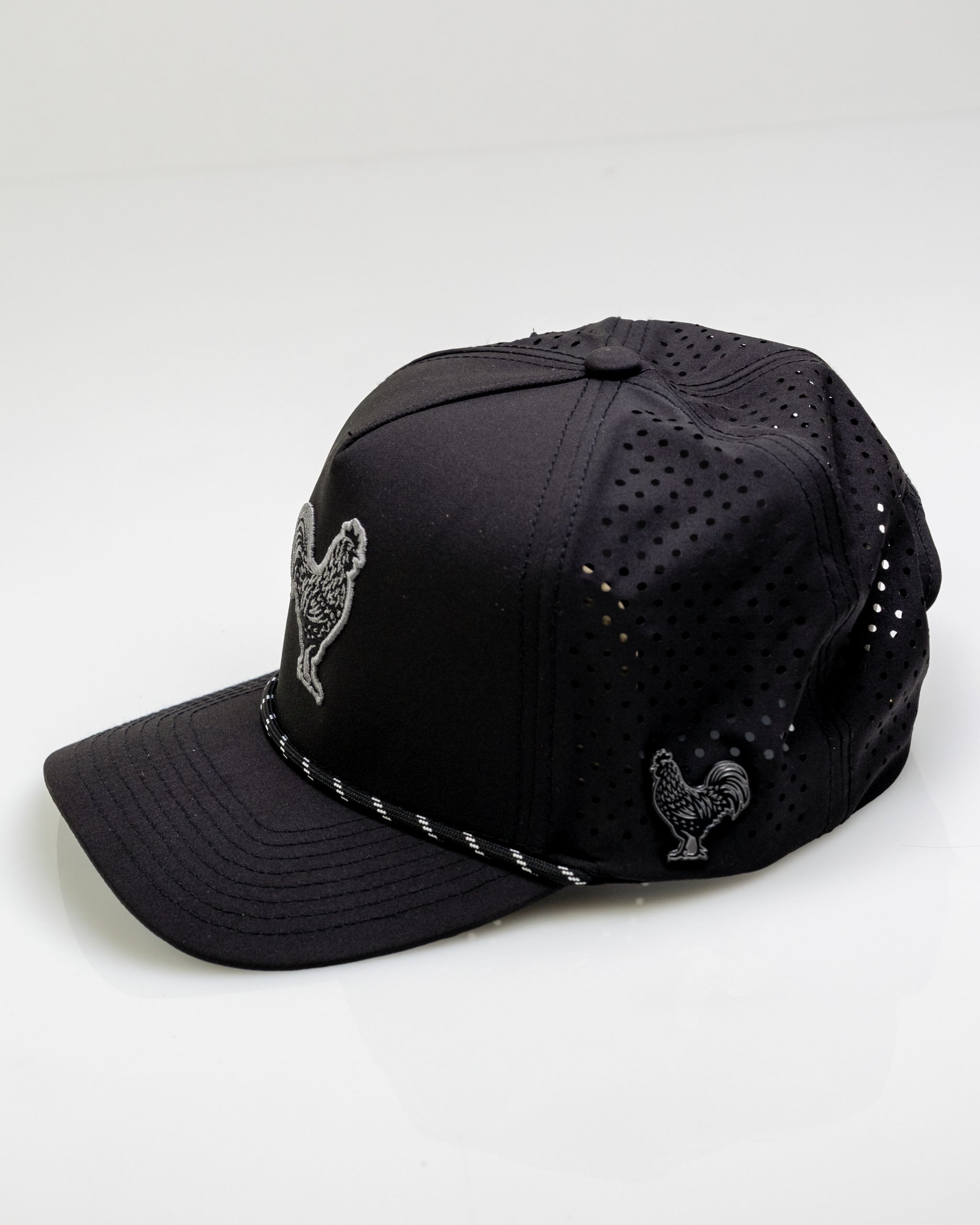 Perforated black rope hat featuring a rooster design, ideal for stylish golfers seeking unique headwear.