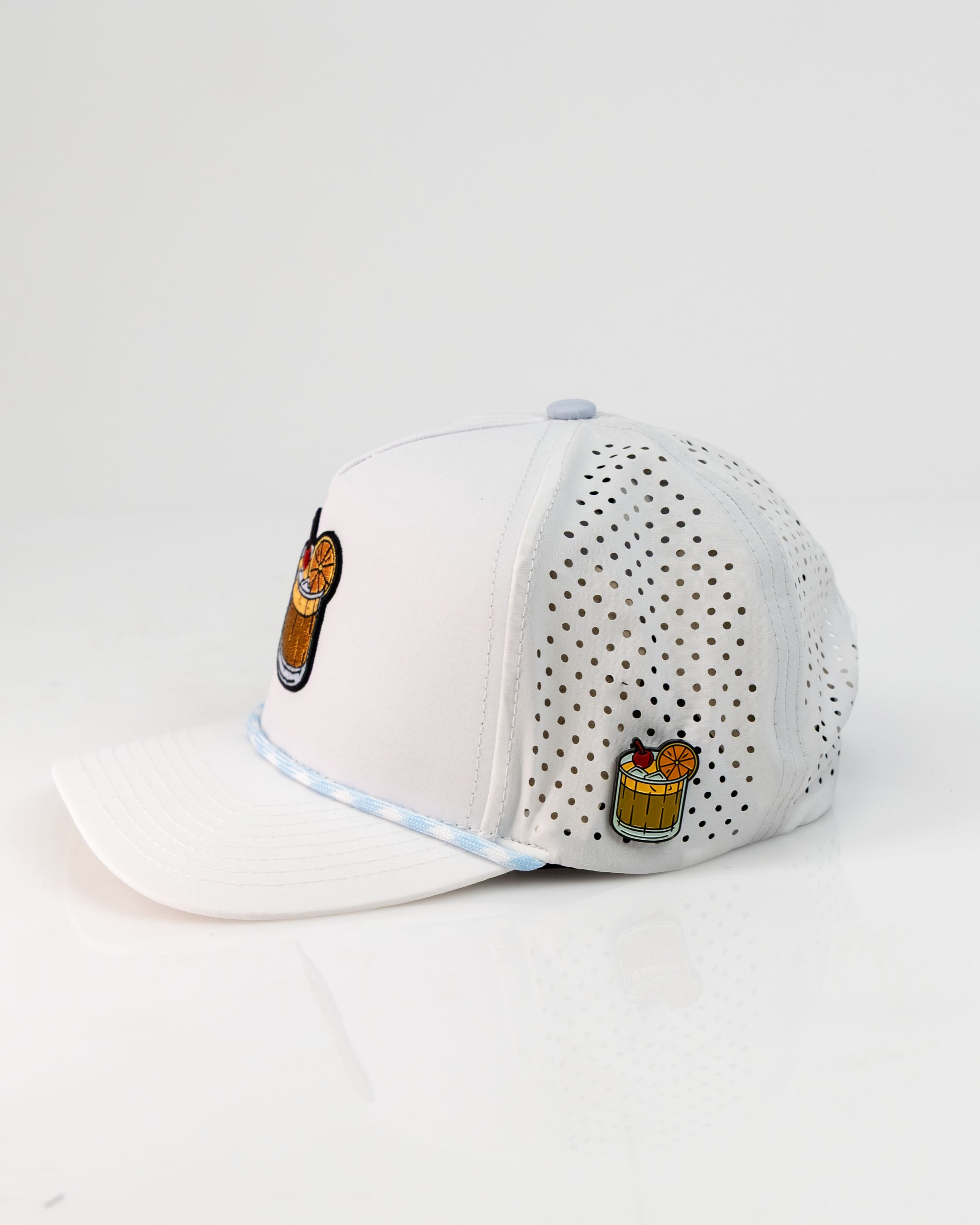 White perforated rope hat featuring Old Fashioned cocktail embroidery on the front and side, perfect for stylish golfers.