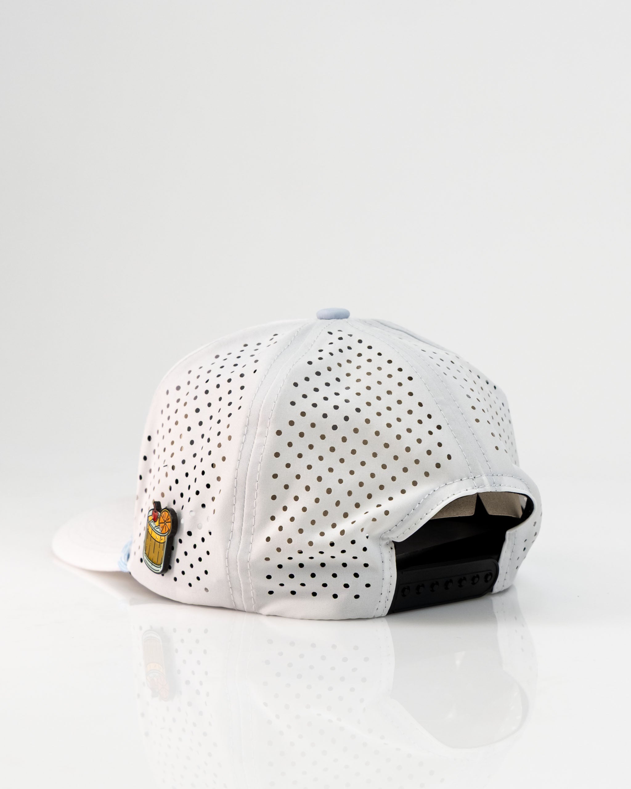 Perforated white rope hat featuring a unique design and adjustable strap for a stylish golf accessory.