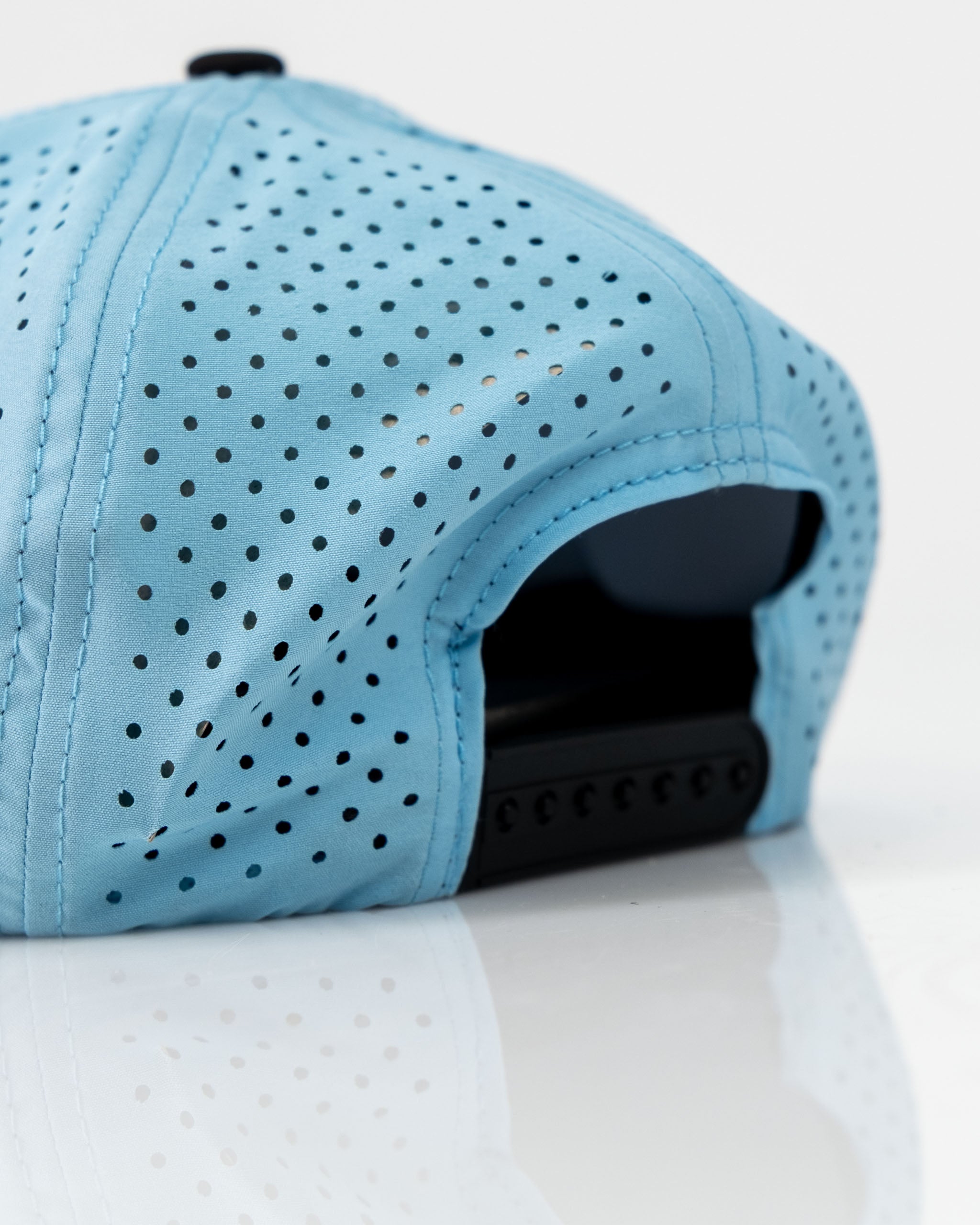 Perforated baby blue rope hat featuring a middle finger design, ideal for bold golfers seeking unique style.