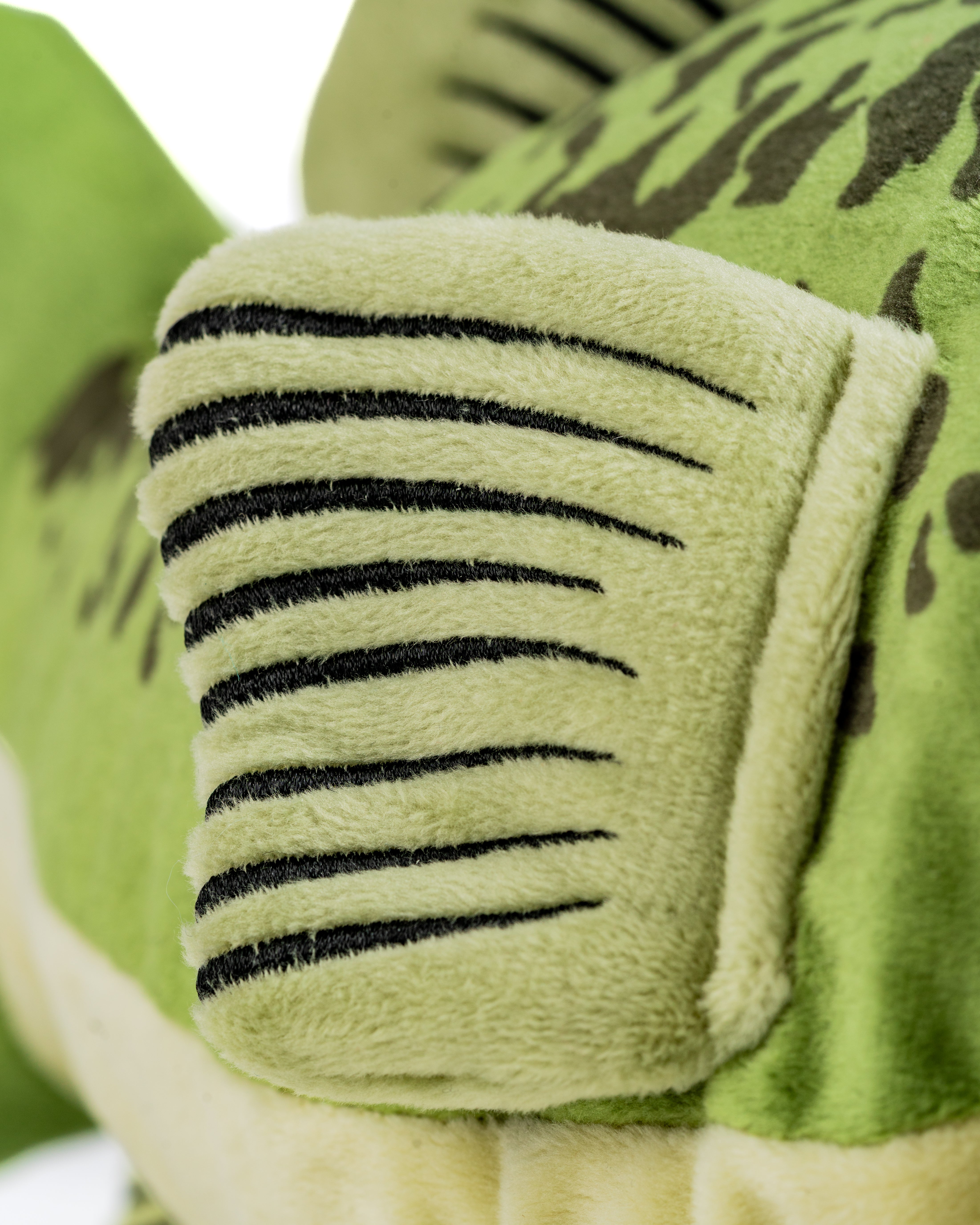Plush bass driver cover featuring detailed scales and textured fins, designed to protect golf clubs with style.