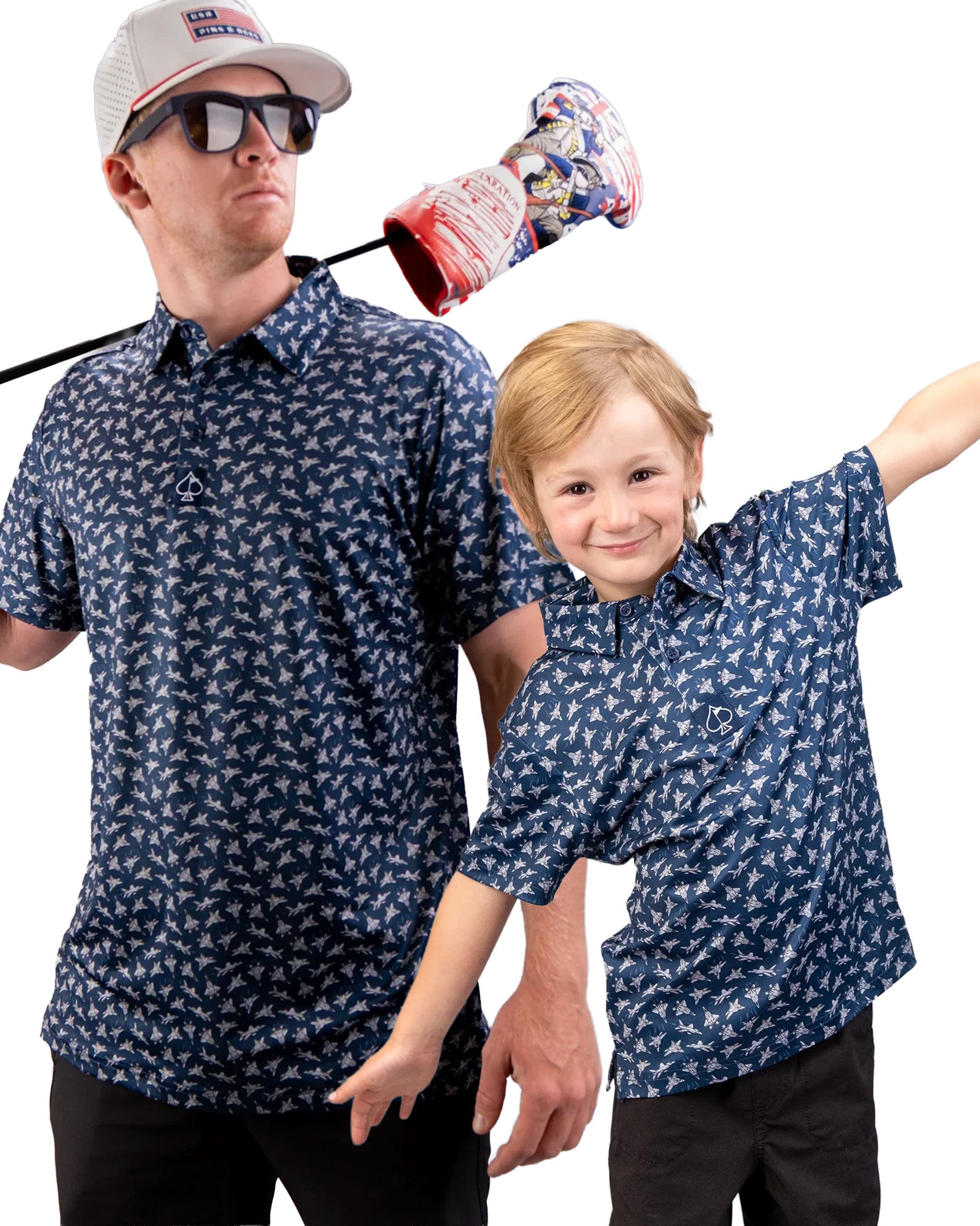 Father and son wearing matching navy polos with a bird pattern, showcasing a fun golf accessory in the background.