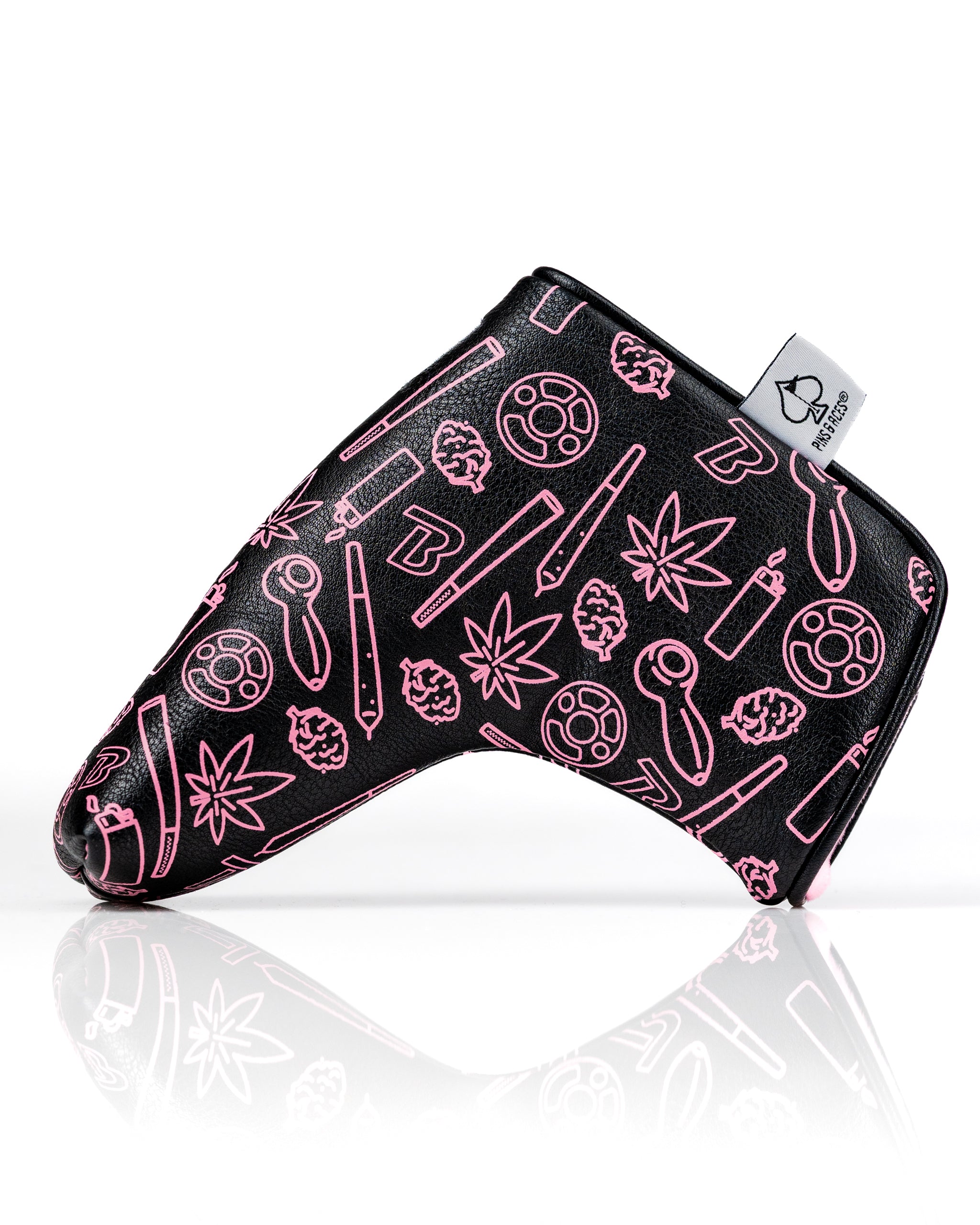 Bold black blade putter cover featuring vibrant pink graphics of cannabis-themed designs, perfect for stylish golfers.