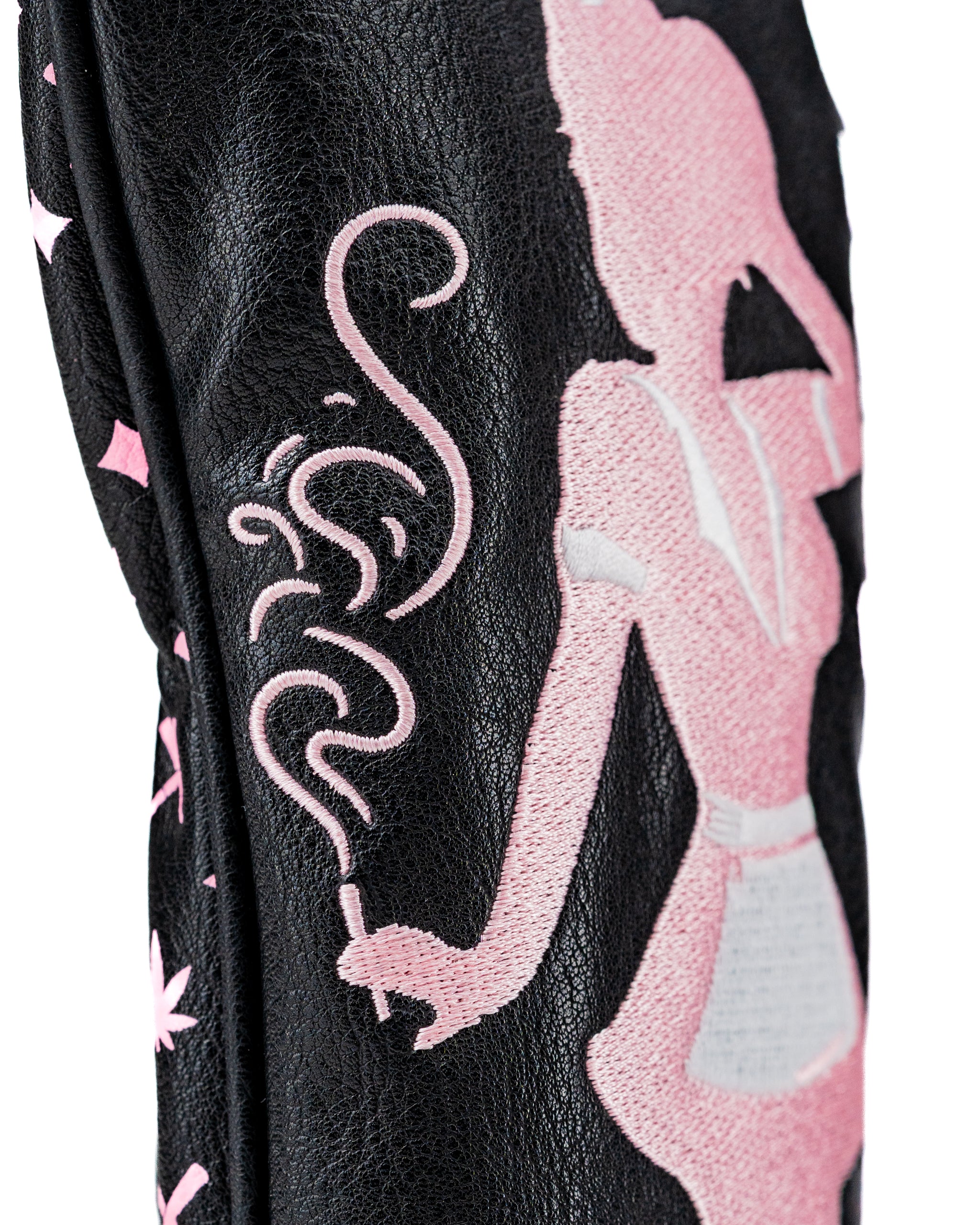 Bold black fairway cover featuring a stylish pink silhouette design, perfect for golfers wanting to stand out on the course.