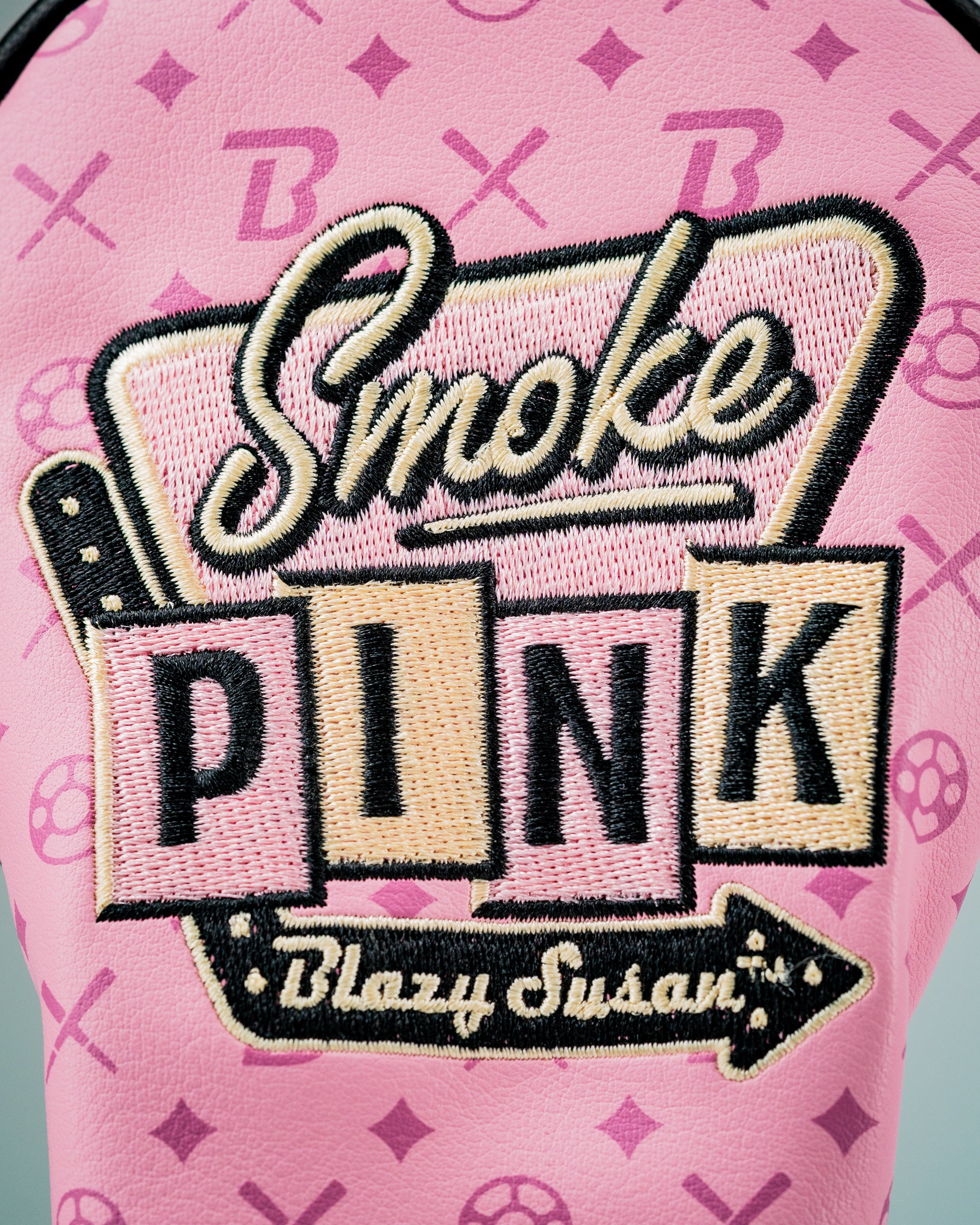 Bold pink hybrid golf cover featuring "Smoke PINK" embroidery and playful design elements for a standout look on the course.