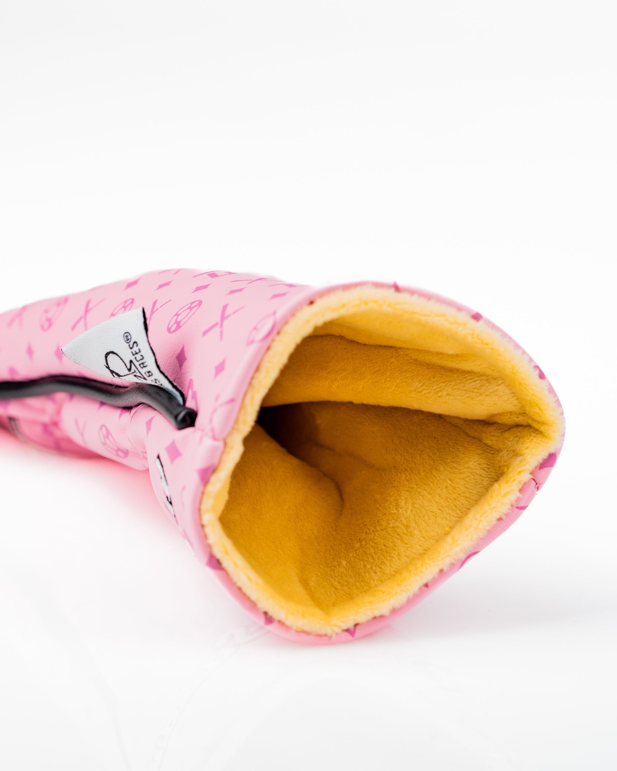 Bold pink hybrid golf club cover with a soft yellow interior, featuring unique patterns for stylish protection on the course.