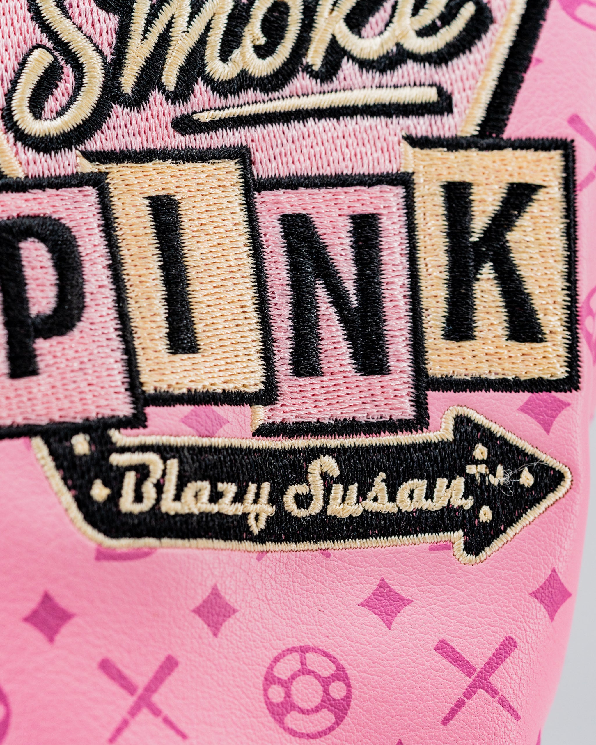 Bold pink hybrid golf cover featuring playful graphics and embroidered text, designed for golfers who want to stand out.