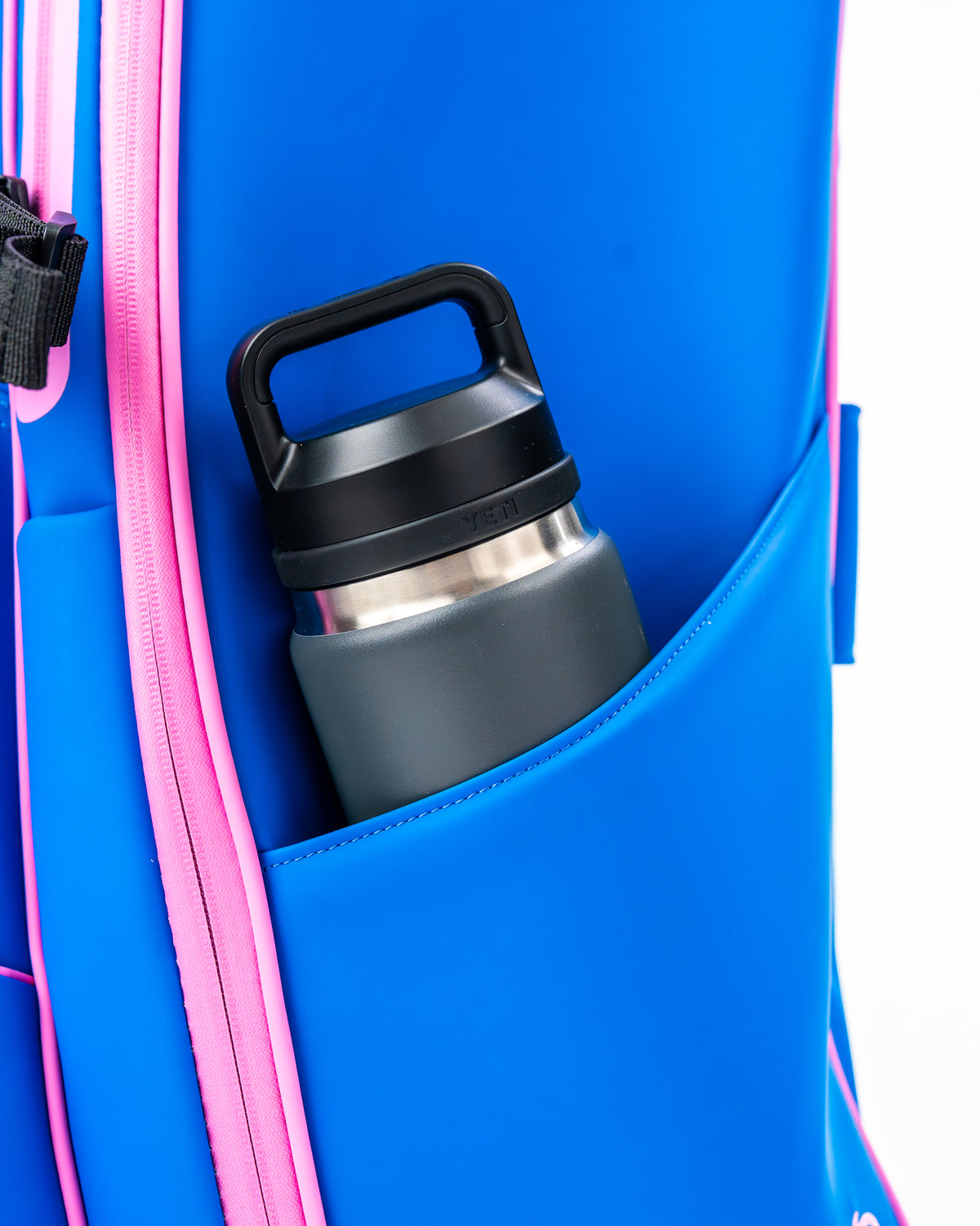 Blue Raspberry Player Preferred™ Golf Bag featuring a side pocket with a water bottle for convenience on the course.